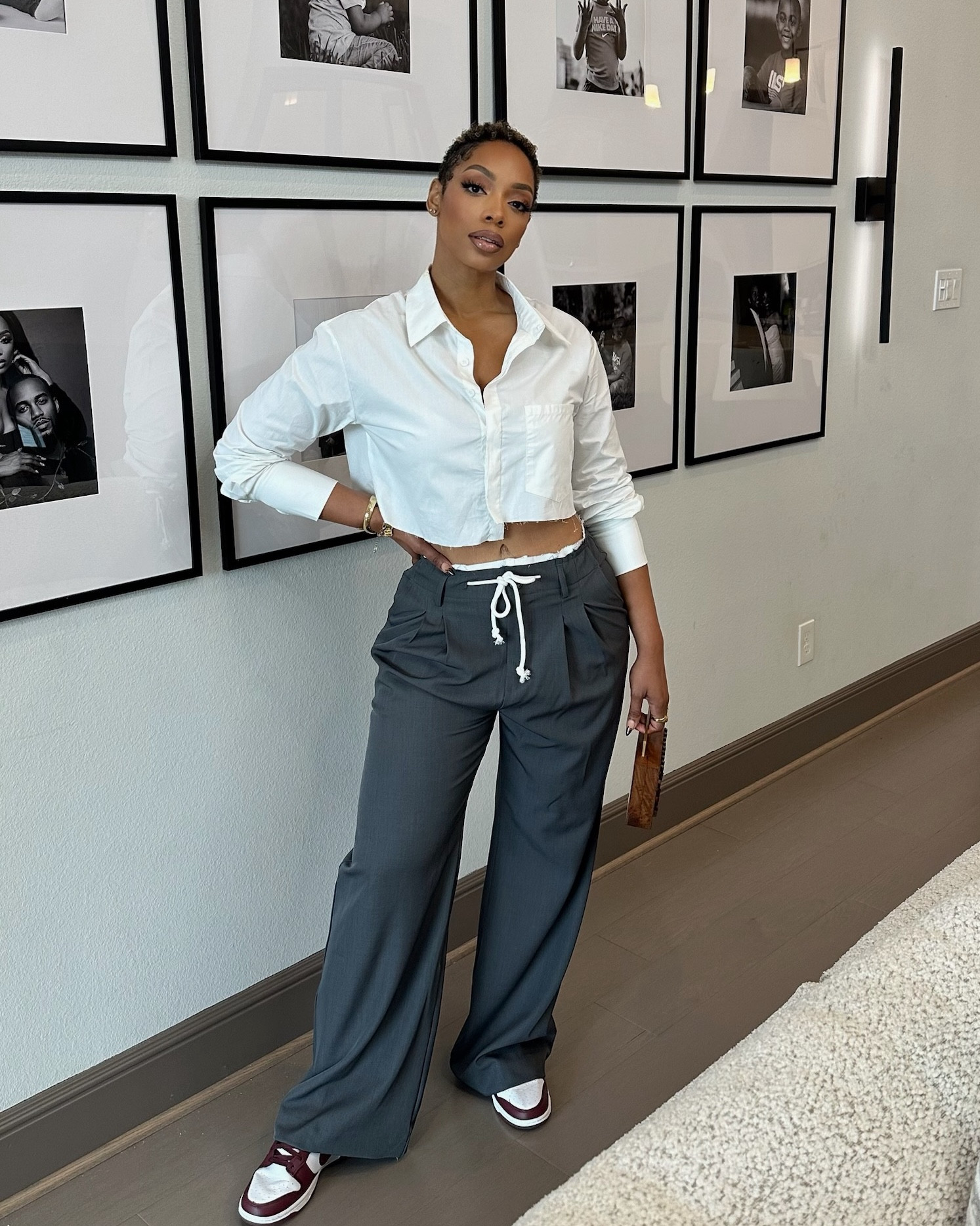 Casual Chic! Stepping out with a playful mix of retro and modern vibes! I'm pairing my classic Nike Dunk Low Retro casual shoes with an Amazon Remidoo asymmetrical crop top for that edgy twist. I’m doubling down on style with both BooHoo Fray Hem double waistband wide-leg pants and a pair of woven pants, creating a unique layered look. To complete the ensemble, I'm carrying the Amazon Jalwa Art brown handcrafted striped wooden clutch—perfect for transitioning from day to night. #OOTD #StyleInspo #LTKLinkInBio