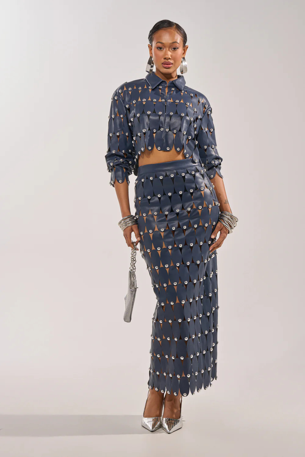 THE SNEAK PEEK STUDDED PU MIDI SKIRT IN NAVY | AKIRA