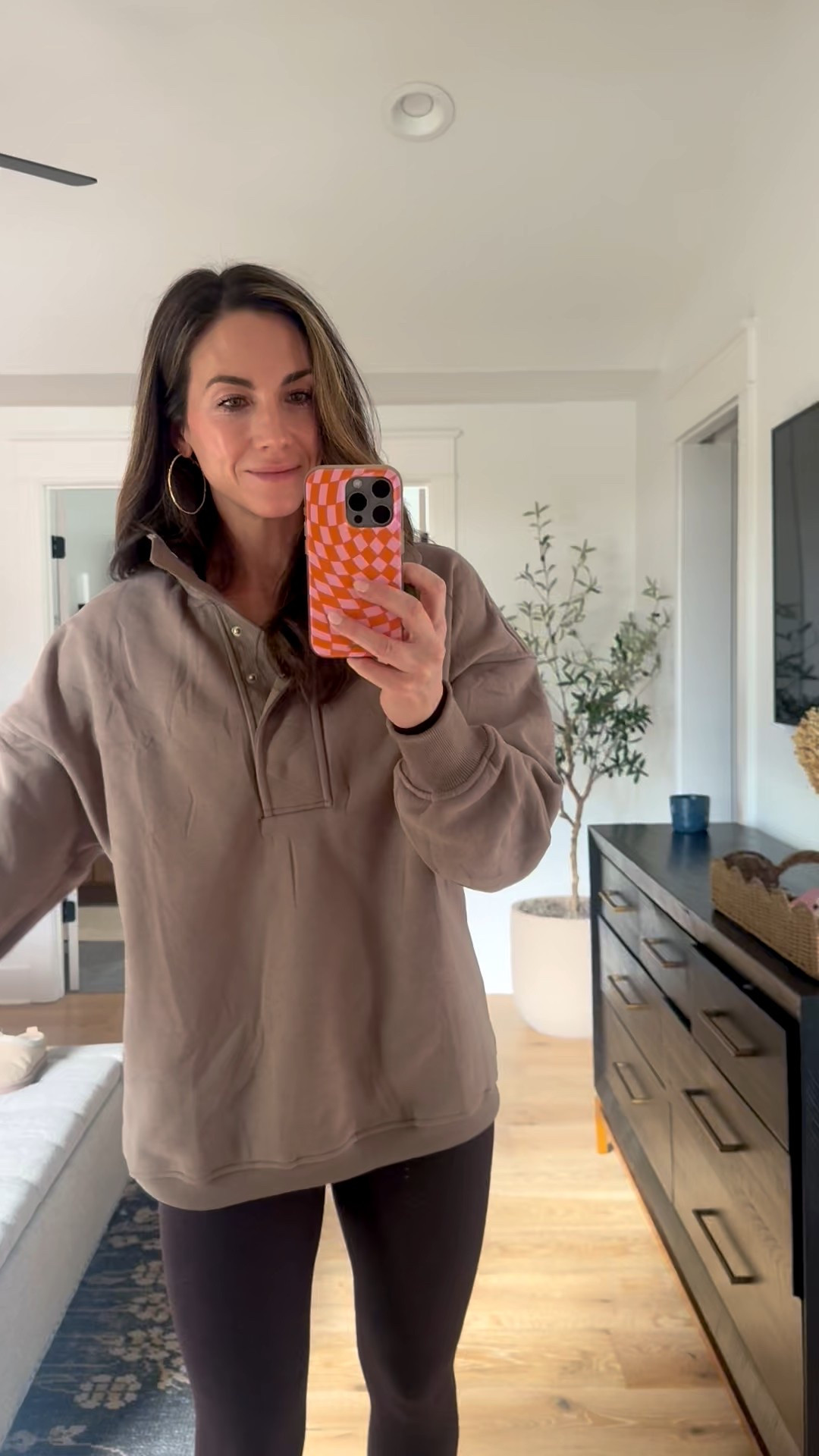 This oversize sweatshirt is super comfy and cute. I love the waffle details on the collar and the fleece lining on the inside. True to size. I am in a small. I would order up if you want to wash and dry it several times. ￼