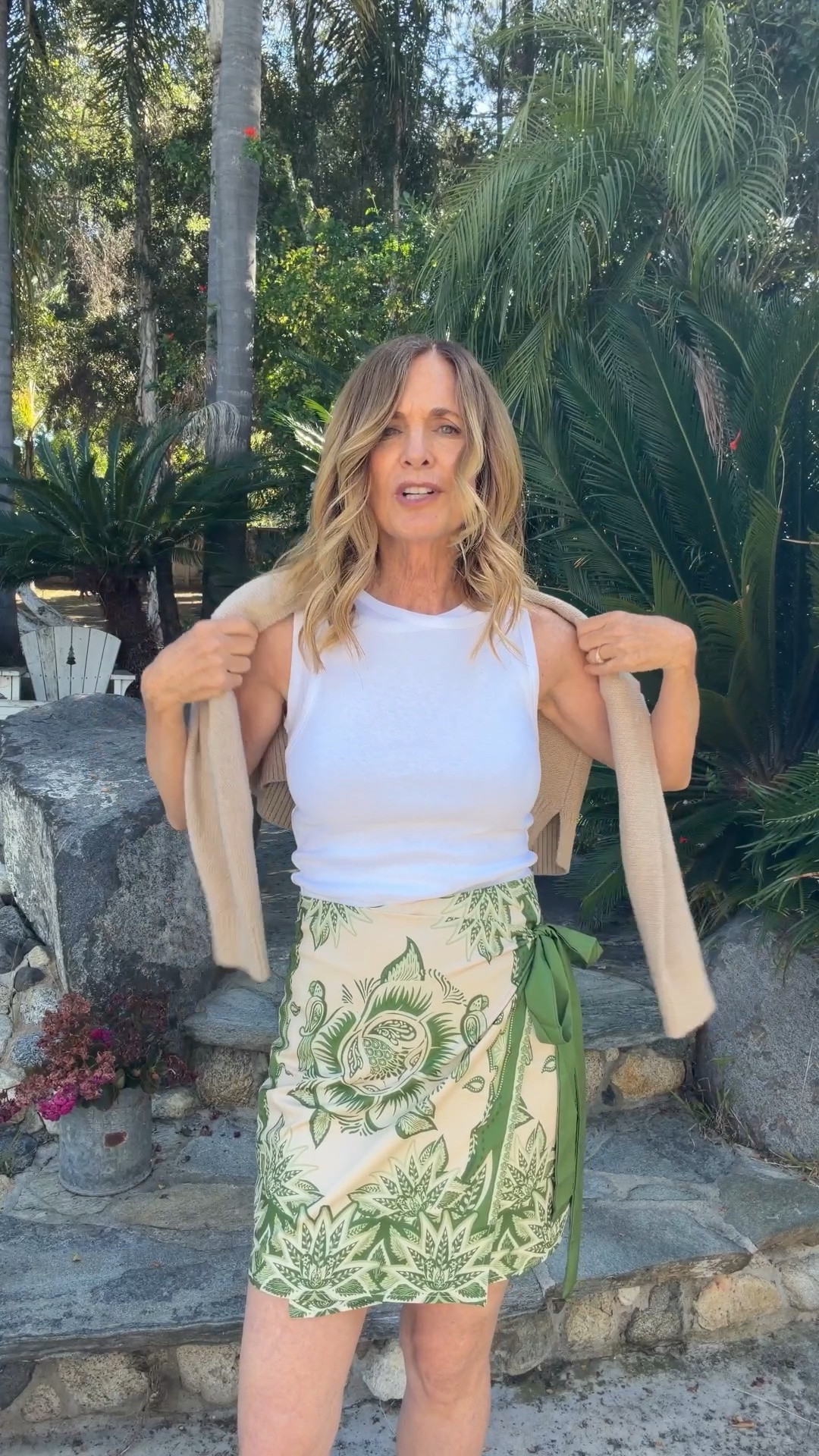 Okay this green silky wrap skirt is giving expensive vacation vibes without the expensive price tag 💚✨

It’s fully lined, so comfy, and honestly looks like something you’d find at Anthro or Farm Rio.

And this double tissue tank top? SO good. Lightweight, flattering, and one of those basics you end up reaching for over and over all summer long.

This whole outfit just feels easy, breezy, and chic 🌴☀️

#LTKootd