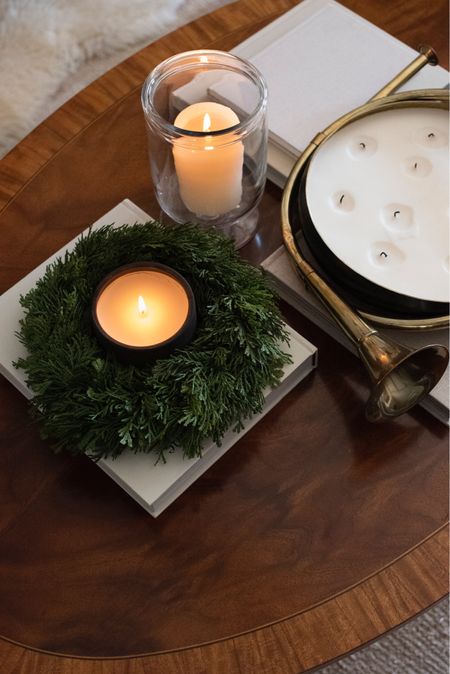Simple holiday coffee table styling… seasonal candles, neutral books, greenery, and something shiny & vintage! 

#LTKSeasonal #LTKhome #LTKHoliday