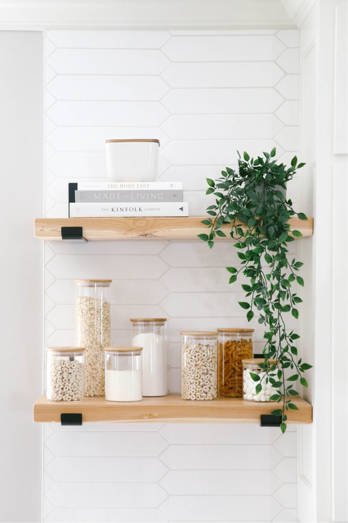 Open shelving in a kitchen can be intimidating. Style with canisters, books in a similar color palette, and add a plant (real or fake) for a pop of color.

#LTKhome