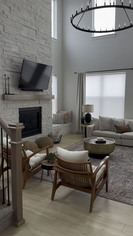 Neutral modern living room with cream sectional sofa and beautiful accent chairs. Large chandelier, modern coffee table and cream curtains 

#LTKstyletip #LTKhome #LTKsalealert