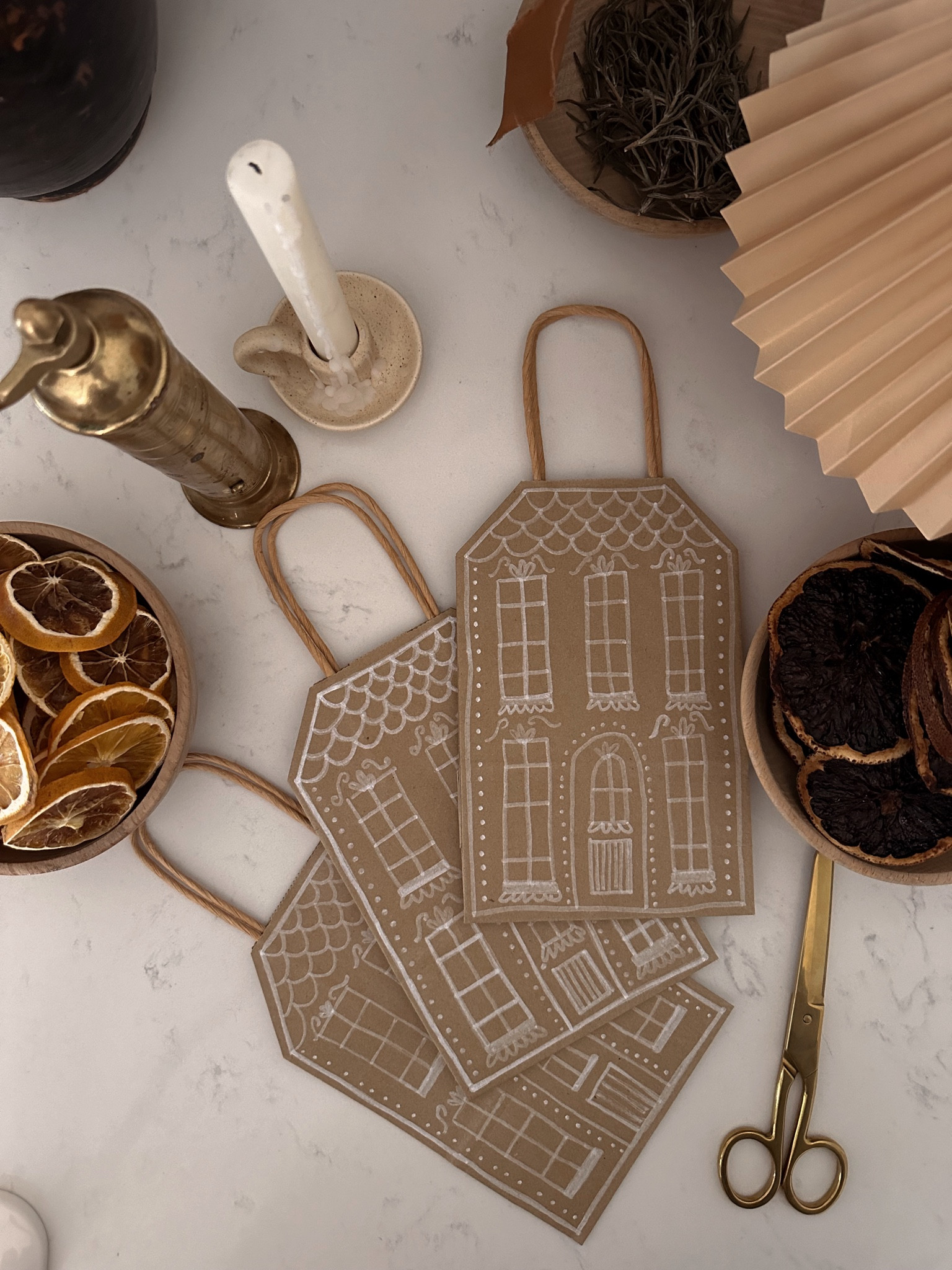 DIY gingerbread house christmas gift
These are super easy to make and so cute for holiday gift bags! All you need are brown kraft paper bags (we got a 3-pack from dollar tree), scissors and a paint pen!
We made these for our teacher gifts and would be great for neighbor gifts and more!

#LTKhome #LTKSeasonal #LTKHoliday