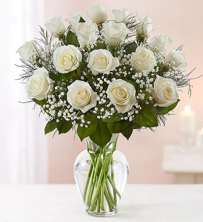 Our pristine white roses are an elegant surprise for someone who brings pure joy to your life. Be... | 1800flowers.com