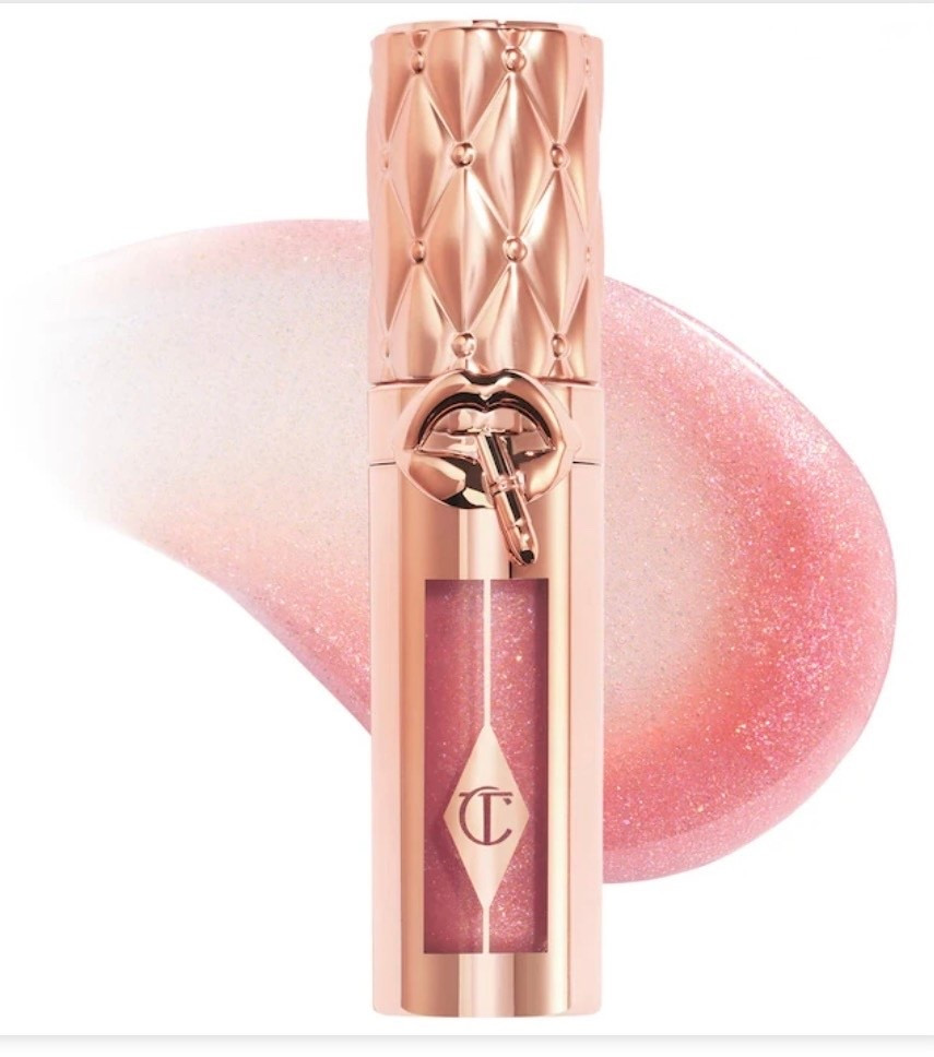 Charlotte Tilbury 
Big Lip Plumpgasm Plumping Lip Gloss

What it is: A high-shine gloss that visibly plumps, smooths, and hydrates lips quickly and over time with a comforting lip oil feel

#LTKWorkwear #LTKootd #LTKWedding