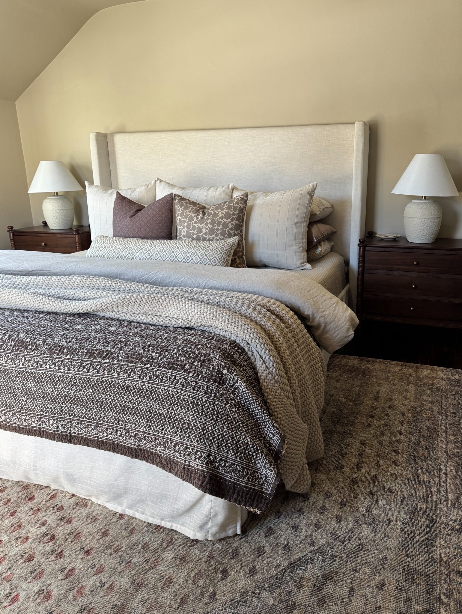 Throw pillows, quilt, blanket are linked. nightstands are OOS. Will link if/when I find them again. Lamps are linked, OOS (I painted them). Bed linked and curtains I used to reupholster it 