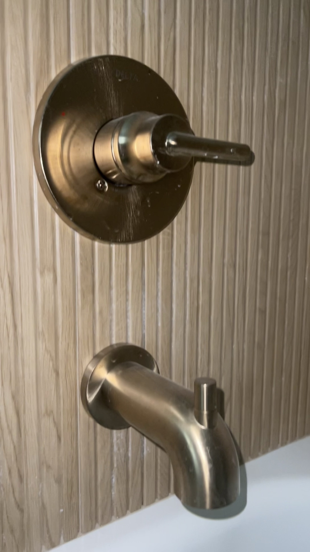 The delta shower system we put in our guest bath giving spa vibes!! Reminds me of a sauna!! #newhome #newconstruction #bathroom #hardware #brushedgold #deltachampagne #mattebrass 

#LTKhome #LTKbaby #LTKfamily