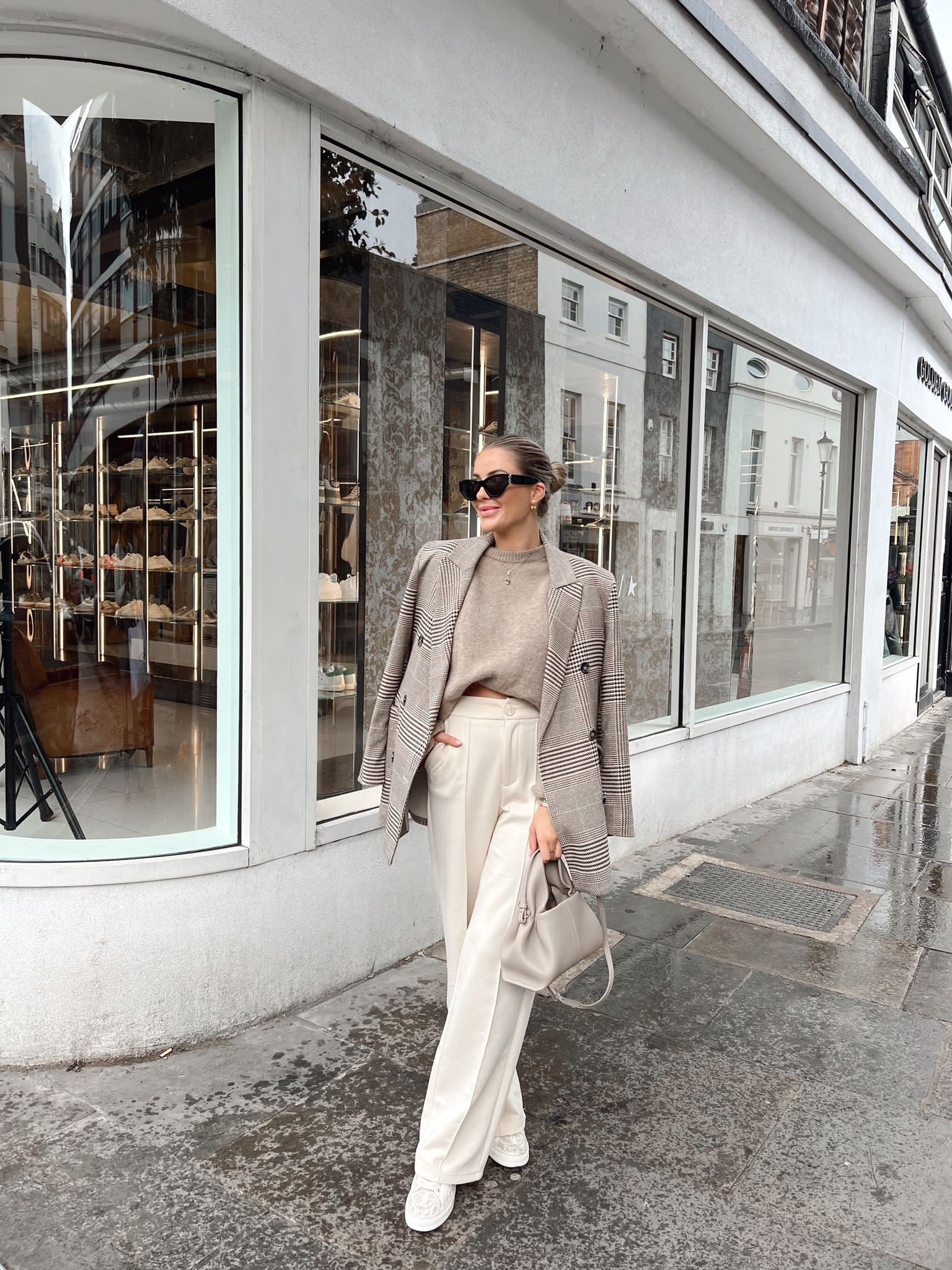 Neutral autumn outfit street style. Beige knit arket jumper, check H&M blazer, white wide fit trousers, Chloe Lauren lace trainers, polene paris bag, ysl sunnies & gold earrings  

#LTKSeasonal #LTKshoecrush #LTKstyletip