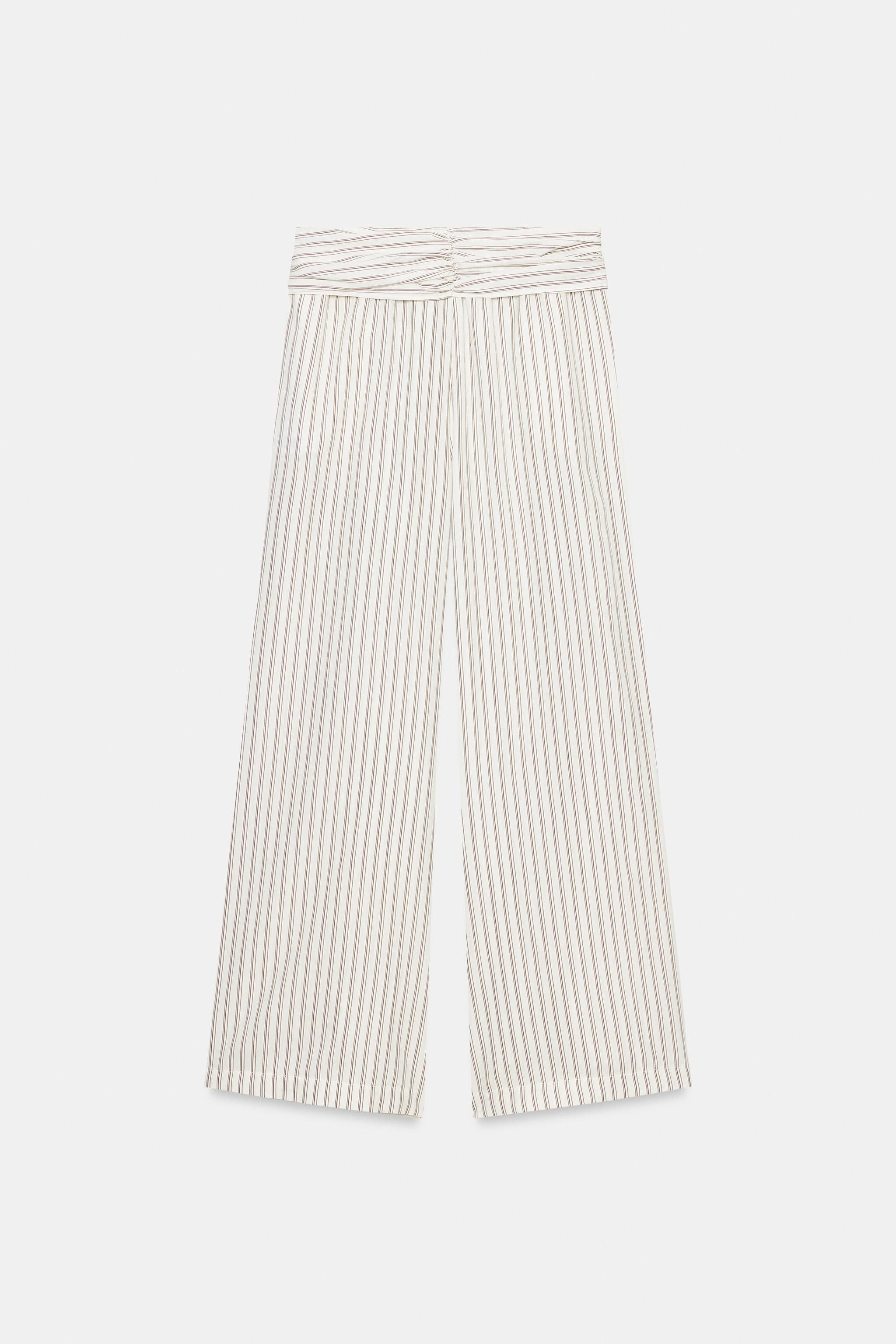 High-waist trousers with a knotted scarf detail and an elasticated waistband. Wide-leg fit. | Zara DE