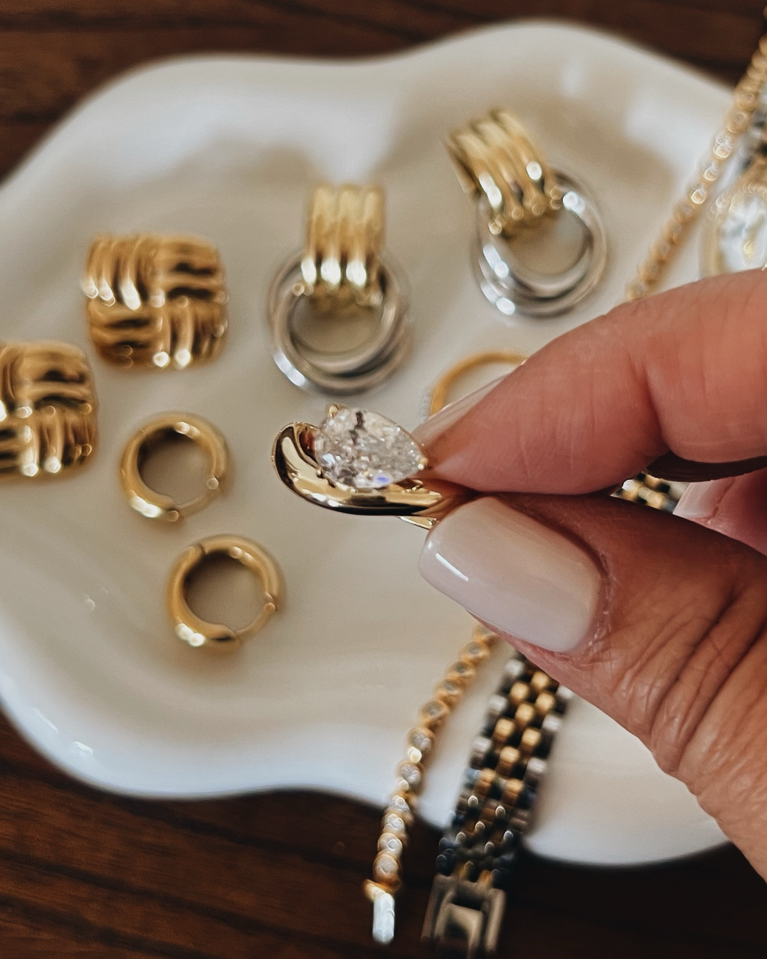 (Mostly) affordable everyday gold jewelry! These are what I rotate daily. My watch ring is from Hearts Valley- I’ve linked a similar one. ALSO The Fiji Bar ring is so sparkly irl but didn’t photograph well at all. 
-
Amazon gold jewelry- affordable gold jewelry- 14k gold jewelry- lab diamond tennis bracelet- 14k gold watch strap bracelet- initial necklace - Pavoi - chunky earrings - Mejuri - Monica Vinader - pave diamond ring - Pavoi pear solitaire diamond ring - everyday gold jewelry - heaven mayhem dupe earrings - gold and silver earrings - square gold earrings - chunky huggie hoops 14k gold- round diamond bezel tennis bracelet 

#LTKStyleTip #LTKGiftGuide #LTKWedding