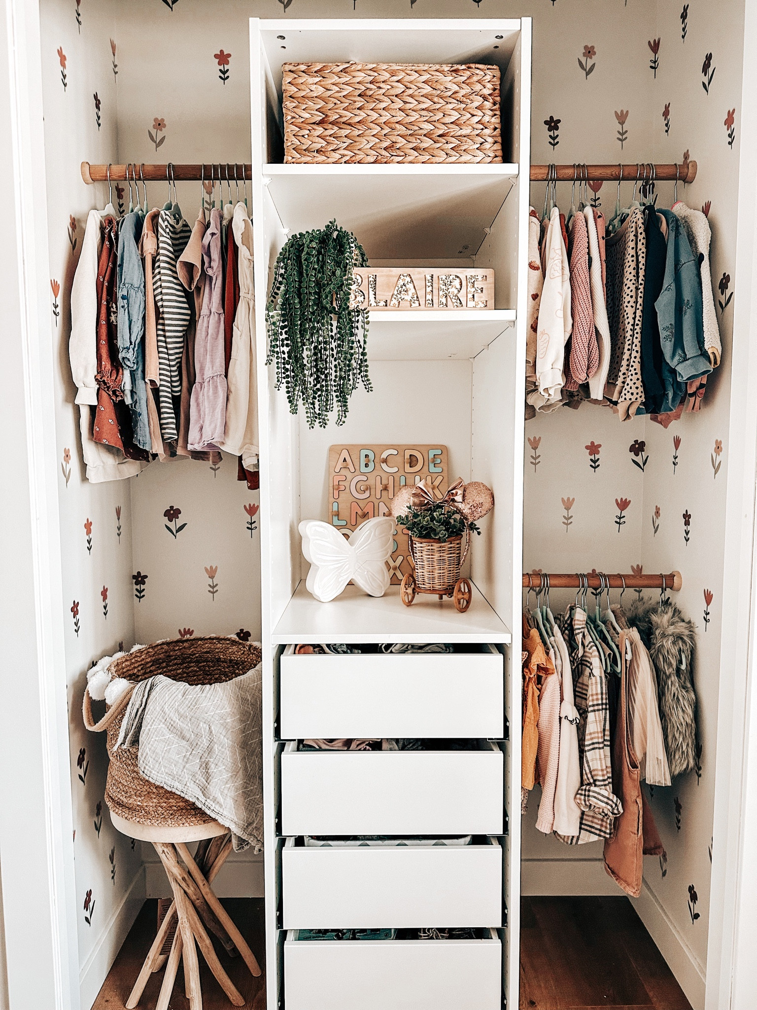 Kids closet refresh using the Ikea Pax system and it turned out so great! I love the added touch the boho flower decals add to the space as it really breaks up all the white! Have you used the Pax system before? 

#LTKhome #LTKfamily #LTKkids