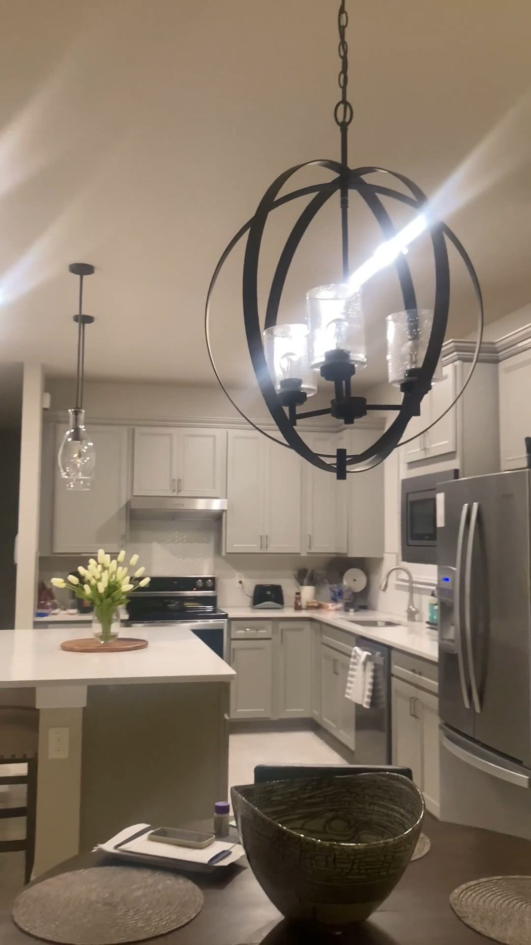 Can we talk about how much difference the right lighting makes? This modern orb chandelier totally transforms the space! It adds the perfect mix of cozy + chic for family dinners or hosting nights.

Would you go bold with a statement light like this?

#ltkhomedecor

#LTKStyleTip #LTKHome