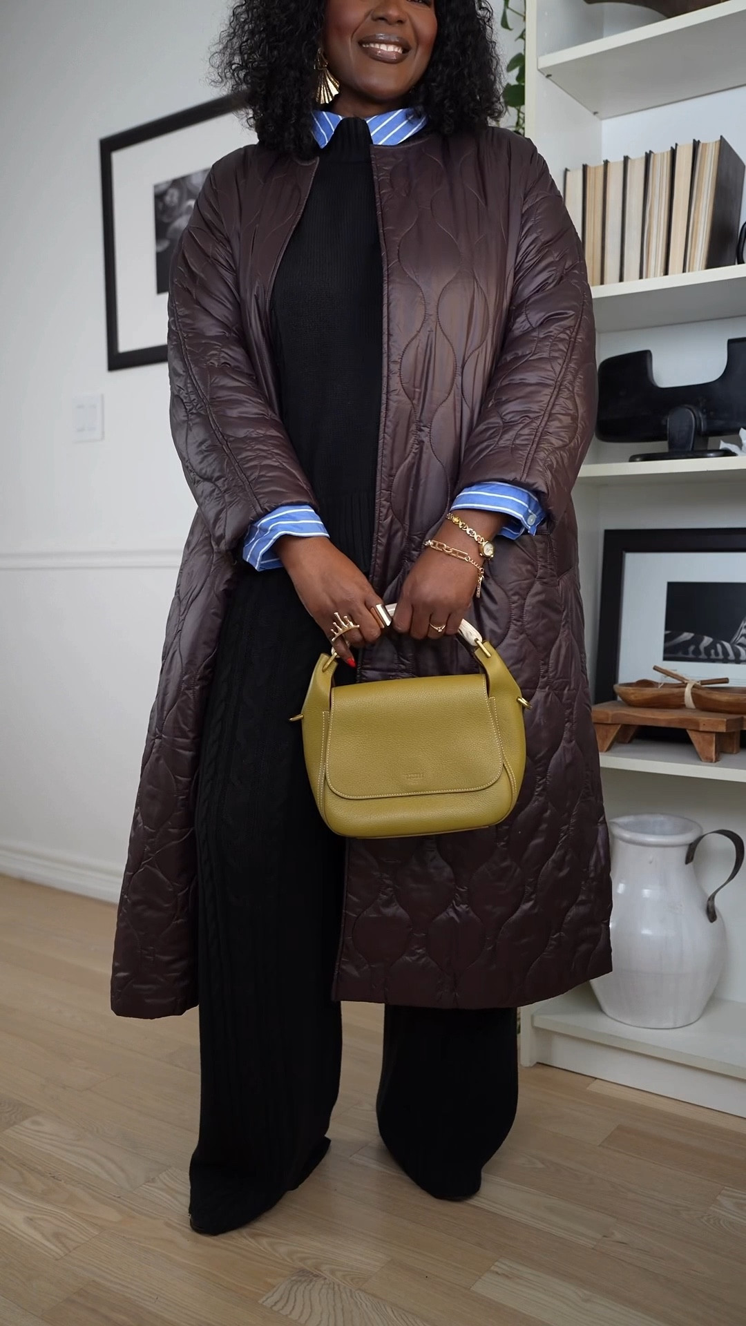 
This is one of those outfits I reach for when it's cold and I don't want to overthink it. This simple and comfy cold weather outfit is one of my favorites for everyday wear. I'm styling a black knit set with a blue stripe shirt layered underneath for extra warmth and contrast and a little bit of dimension. The burgundy long puffer coat adds a cozy fall-to-winter layer, while loafers keep it practical for busy days. I finished the look with a chartreuse bag for a fun pop of color. Easy, wearable, and perfect for casual winter outfits you'll reach for on repeat. #winteroutfits 

#LTKPlusSize #LTKgrwm #LTKMidsize