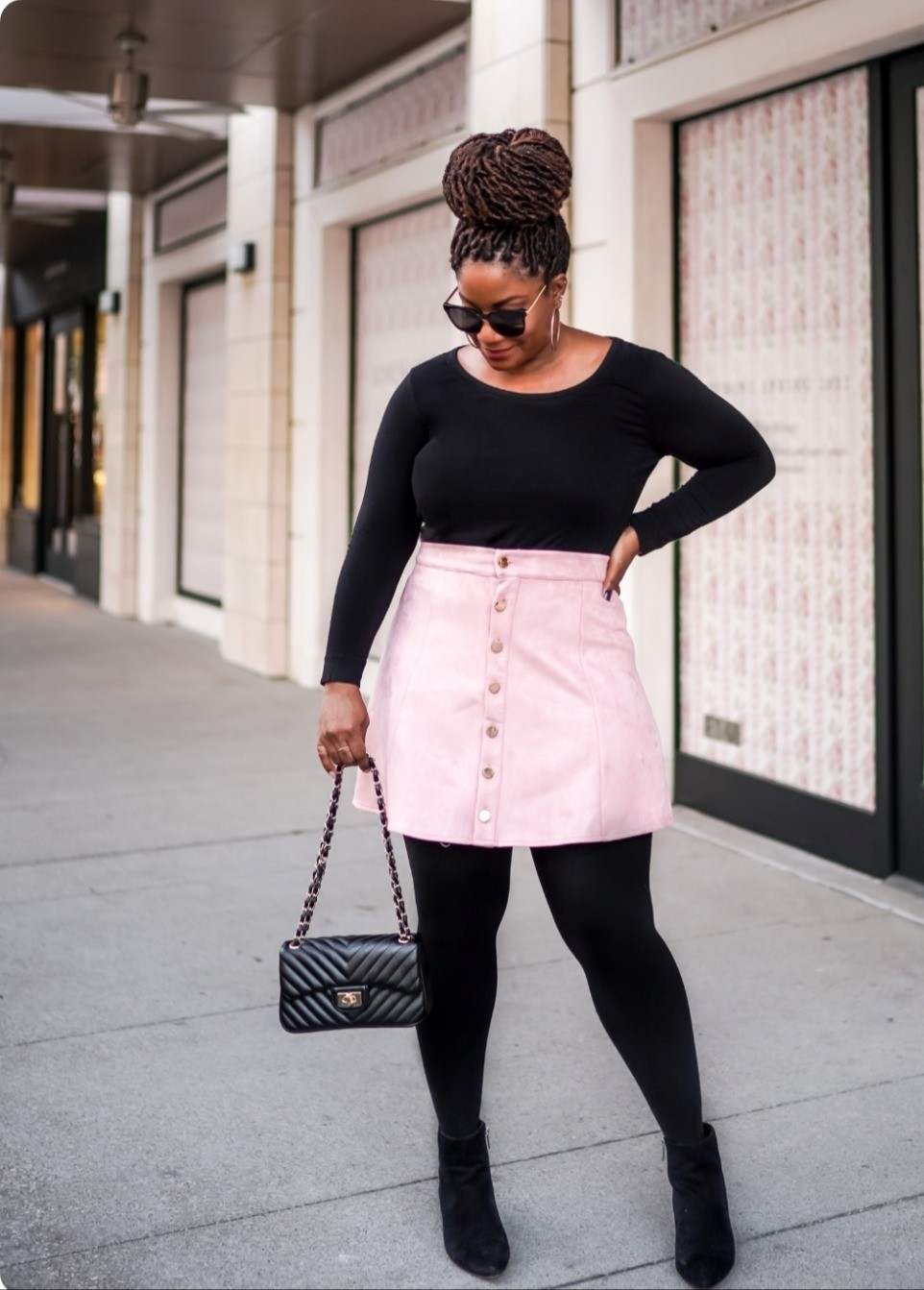 Black and pink perfection! 🖤💗 This classic combo pairs a fitted black long-sleeve top with a pink button-front mini skirt for the perfect balance of chic and playful. Shop this look below!

black and pink outfit / pink mini skirt / black bodysuit / button front skirt / black tights / quilted bag / chanel inspired bag / black ankle boots / street style / casual chic / winter outfit / pink skirt outfit / fitted top / mini skirt styling / black boots outfit / sunglasses style / color block outfit / date night outfit / brunch outfit / weekend style / fashion blogger outfit / trendy outfit / pink and black / statement skirt / classic style / effortless chic

#LTKHoliday #LTKSeasonal #LTKMidsize