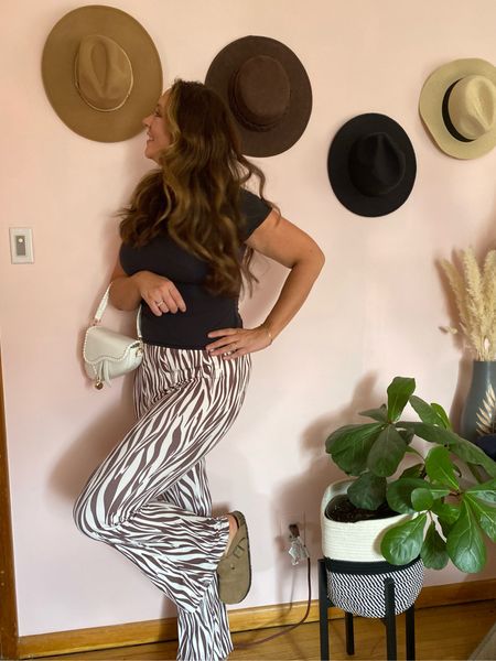 The cutest trendy brown stripe flare pants paired with a skims top and a cute amazon purse! Perfect little spring outfit and the pants are tall friendly! 

#LTKstyletip #LTKFind #LTKunder50
