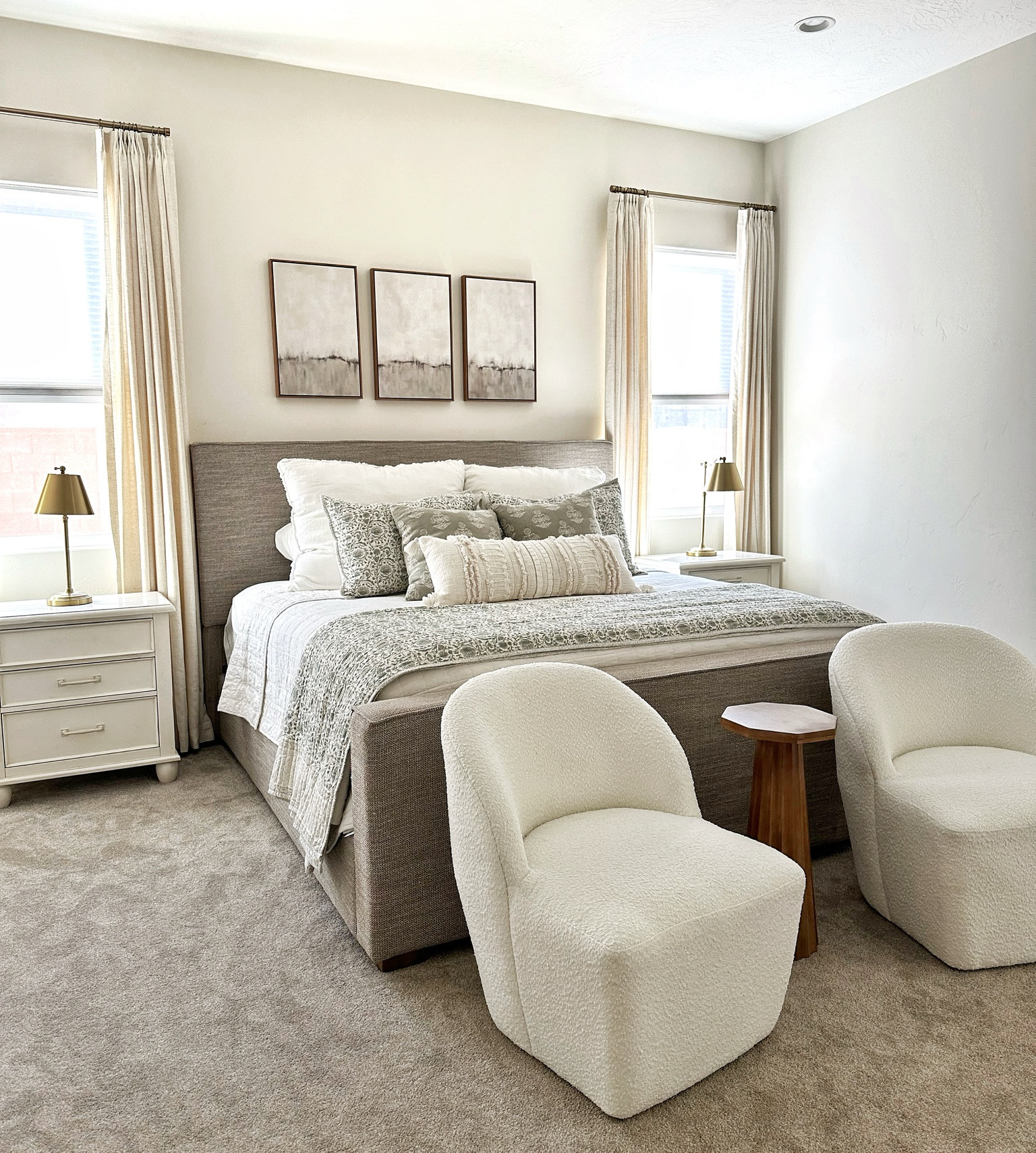 A beautiful neutral and layered Master Bedroom design with a cozy upholstery bed that you can sleep comfortably in and relax while enjoying the airy and light feel this room has to offer. I’m loving how my bedroom turned out as I’m trying to turn a pain boring room into an inviting home. 

#LTKfindsunder100 #LTKhome #LTKSeasonal