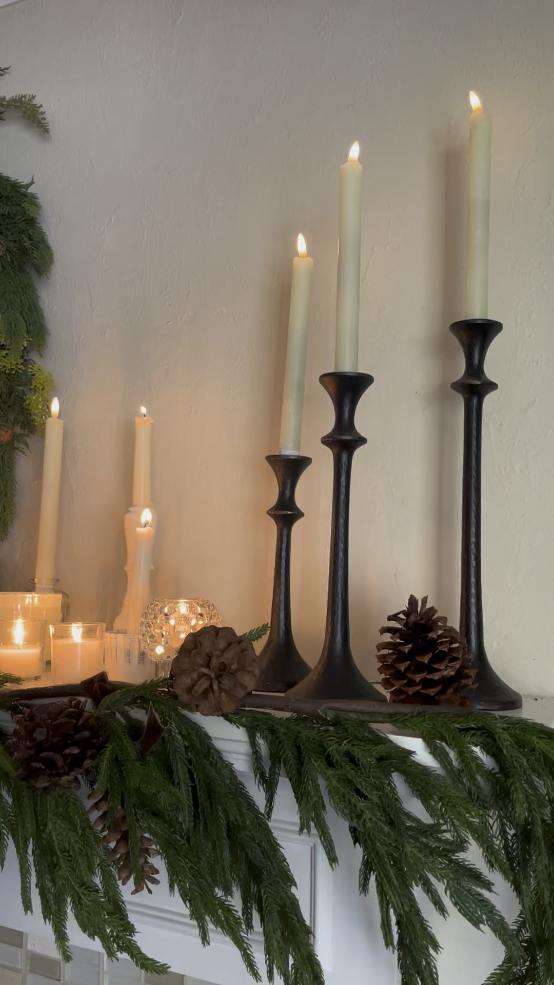 Sharing my mantel.  I used two real touch garlands and wreath.  Used various candle holders and mixed battery operated candles with real.  This year I’m adding more candles for that pretty cozy glow. 
The wreath and garland are going to go fast because they look so realistic and beautiful quality. 

#LTKHoliday #LTKSeasonal #LTKhome