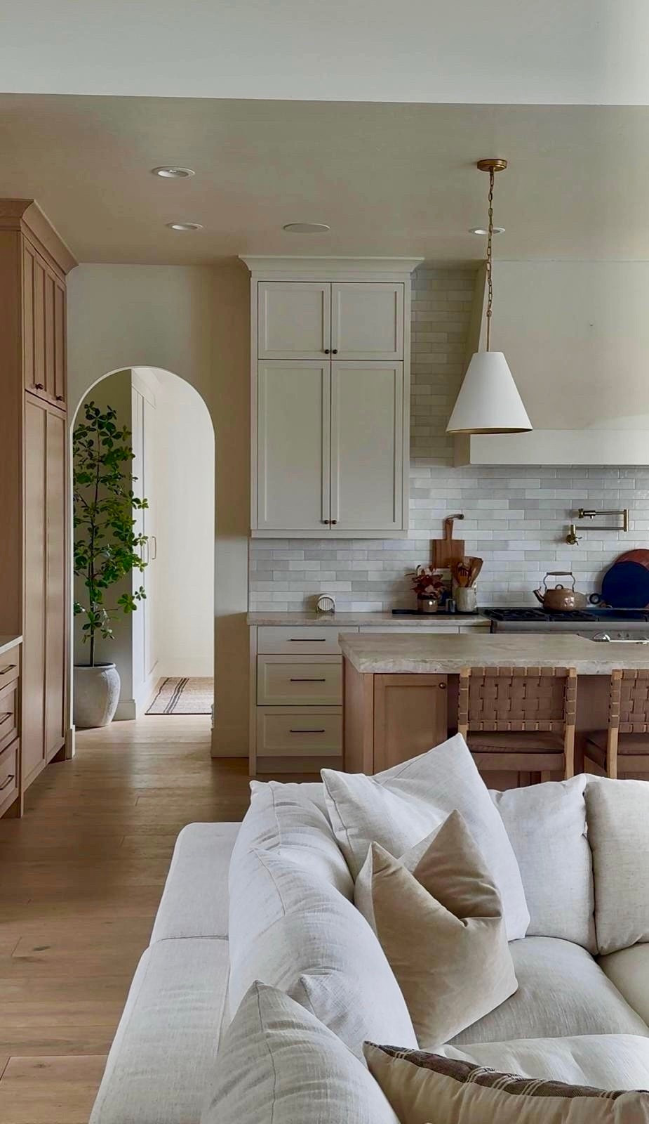 I’m linking the pieces that carry this living room into the kitchen so everything feels connected. The sectional, pillows, woven counter stools, pendant lighting, and warm wood cabinetry all work together to create a soft, cohesive look.

I like keeping materials consistent across spaces so it feels calm and easy to live in from every angle. Sharing the pieces here if you’re building a warm, neutral home that flows naturally.
 @Wayfair 
@lowes 
@Nathan James 

#LTKSaleAlert #LTKHome #LTKU