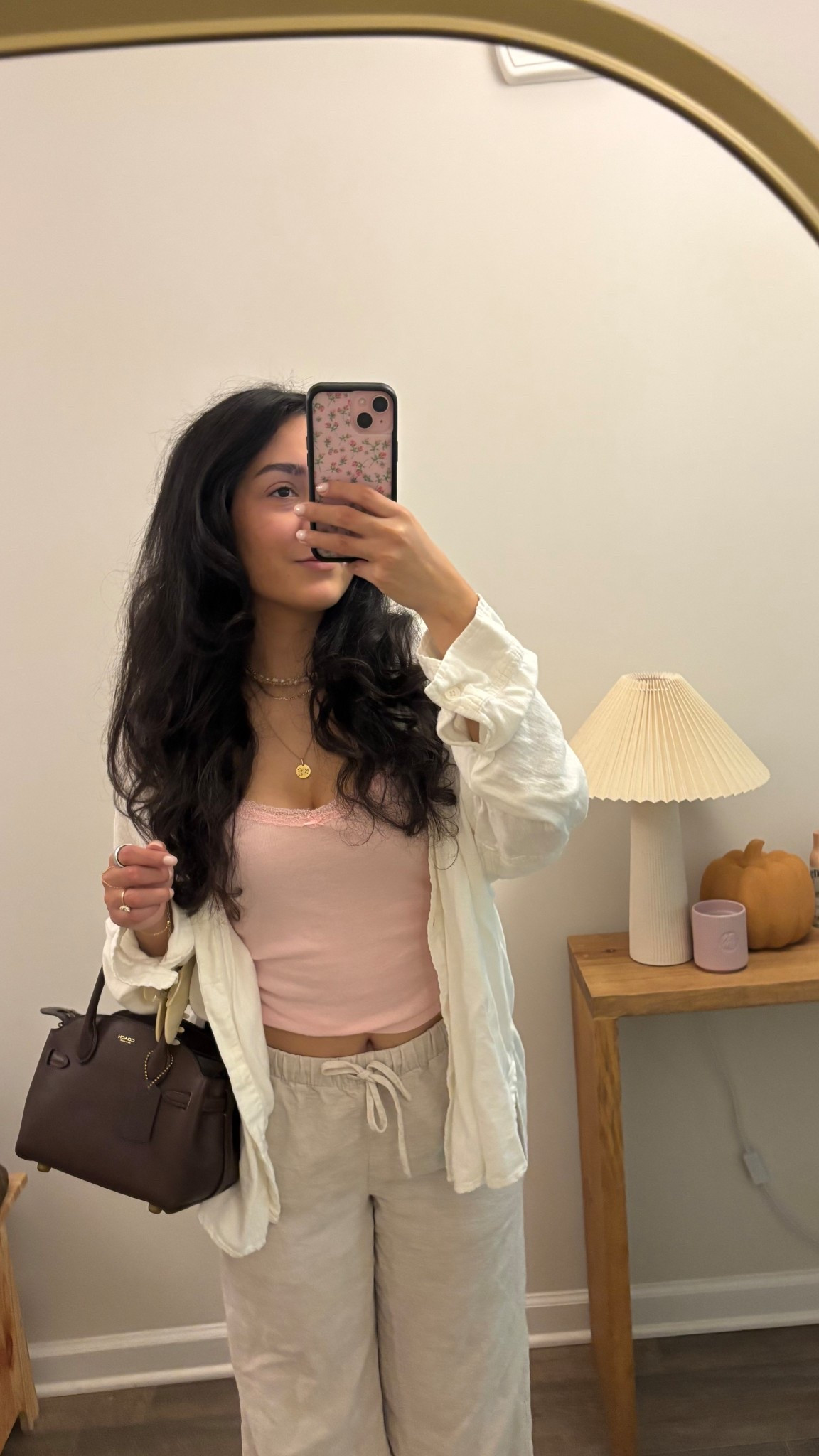 No Boundaries lace trim tank (s)
Aritzia lodge linen pants in natural ecru  (s)
Coach empire 21 in maple
Mejuri zodiac necklace 