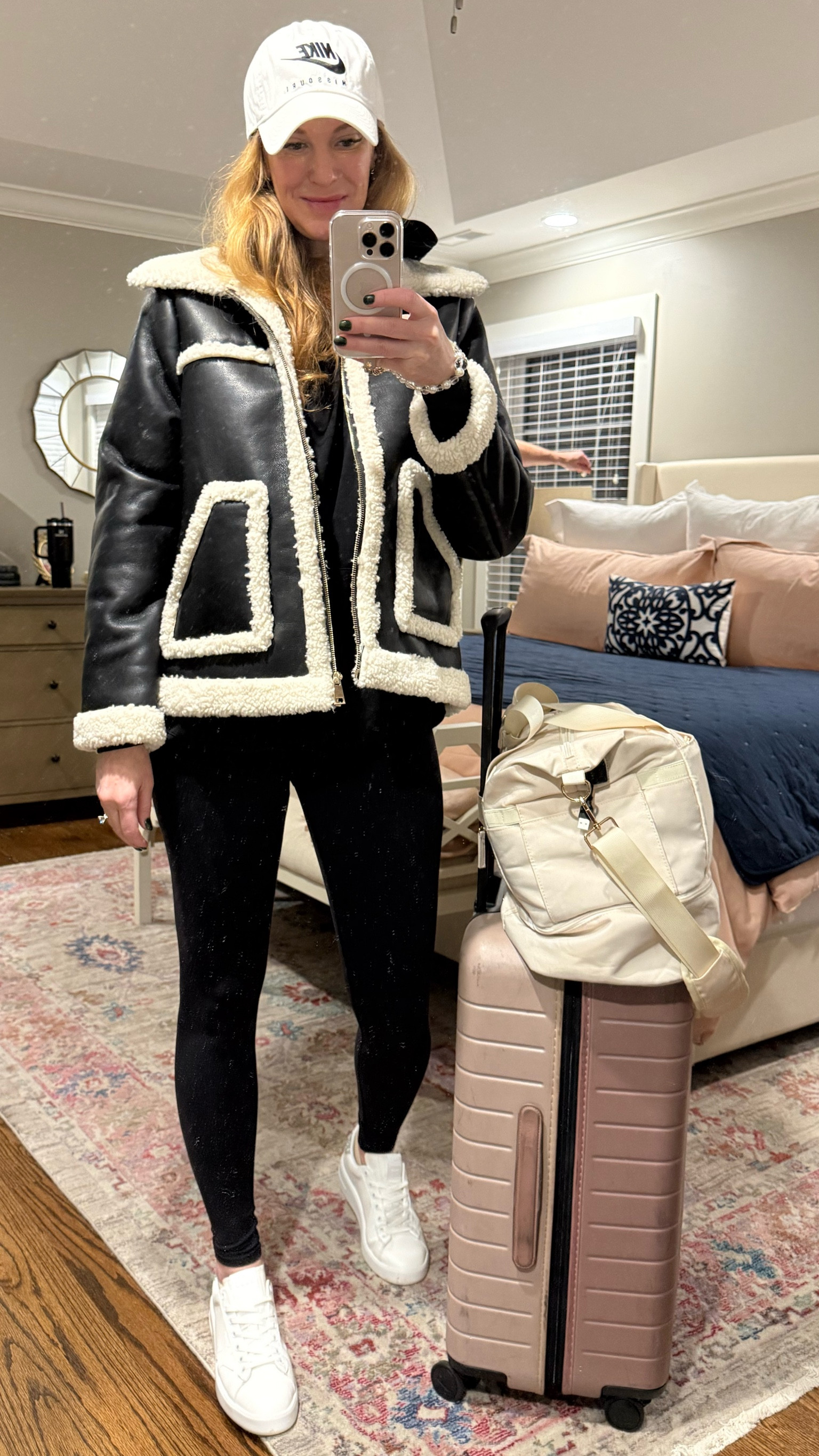 When I have early flights I want to be comfortable but not sloppy. All black in Alo Airbrush leggings and an Alo black hoodie with my cozy leather and Sherpa jacket. I’m ready for Canada! 🇨🇦 

#LTKTravel #LTKSeasonal #LTKActive