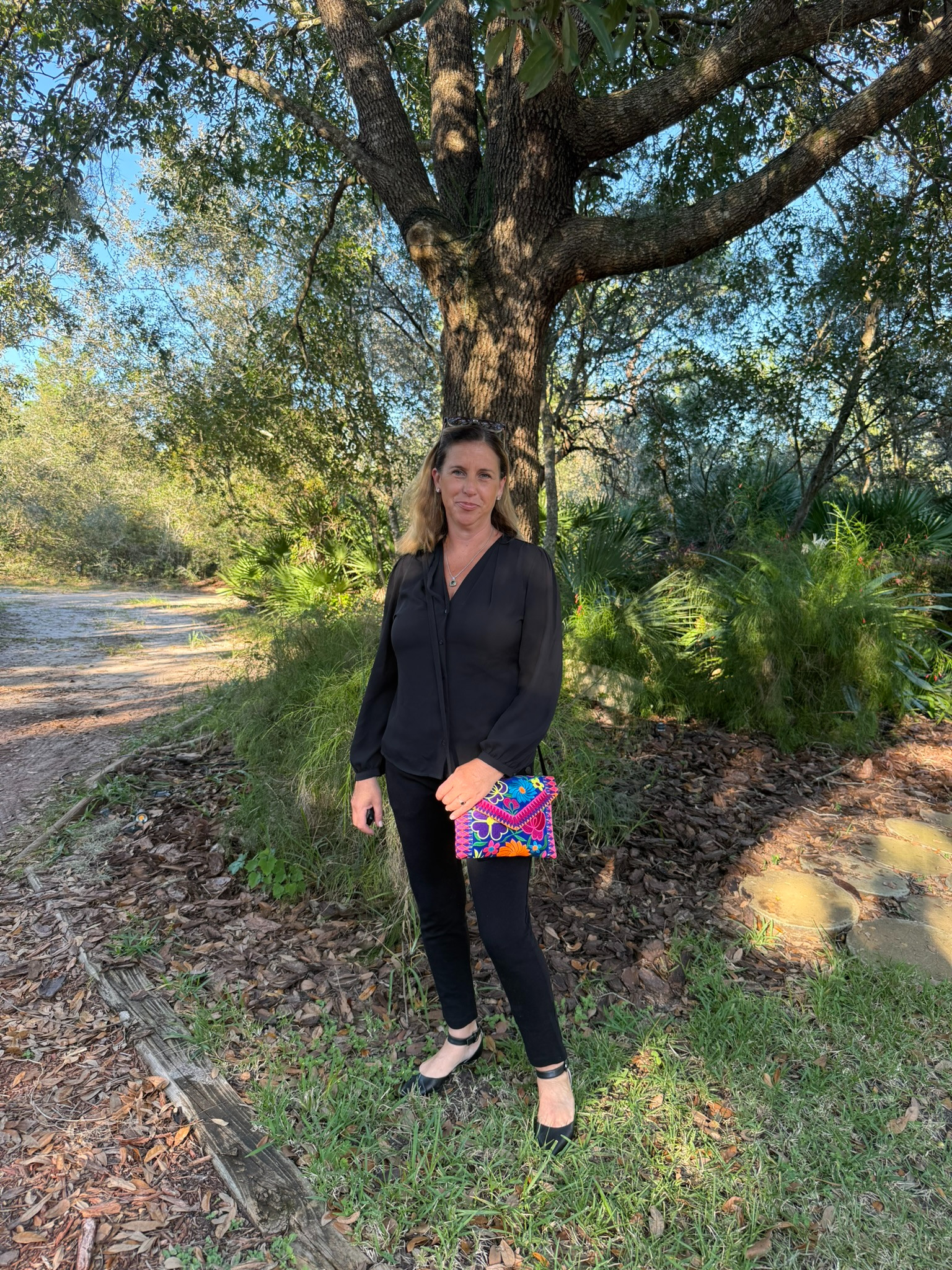 Added a pop of color to my all-black meeting outfit with my handmade embroidered purse! I love how the vibrant colors stand out... if I’m not traveling, I’m at least showing off something from my adventures! 

 #LTKGiftGuide #LTKOver40 #LTKTravel