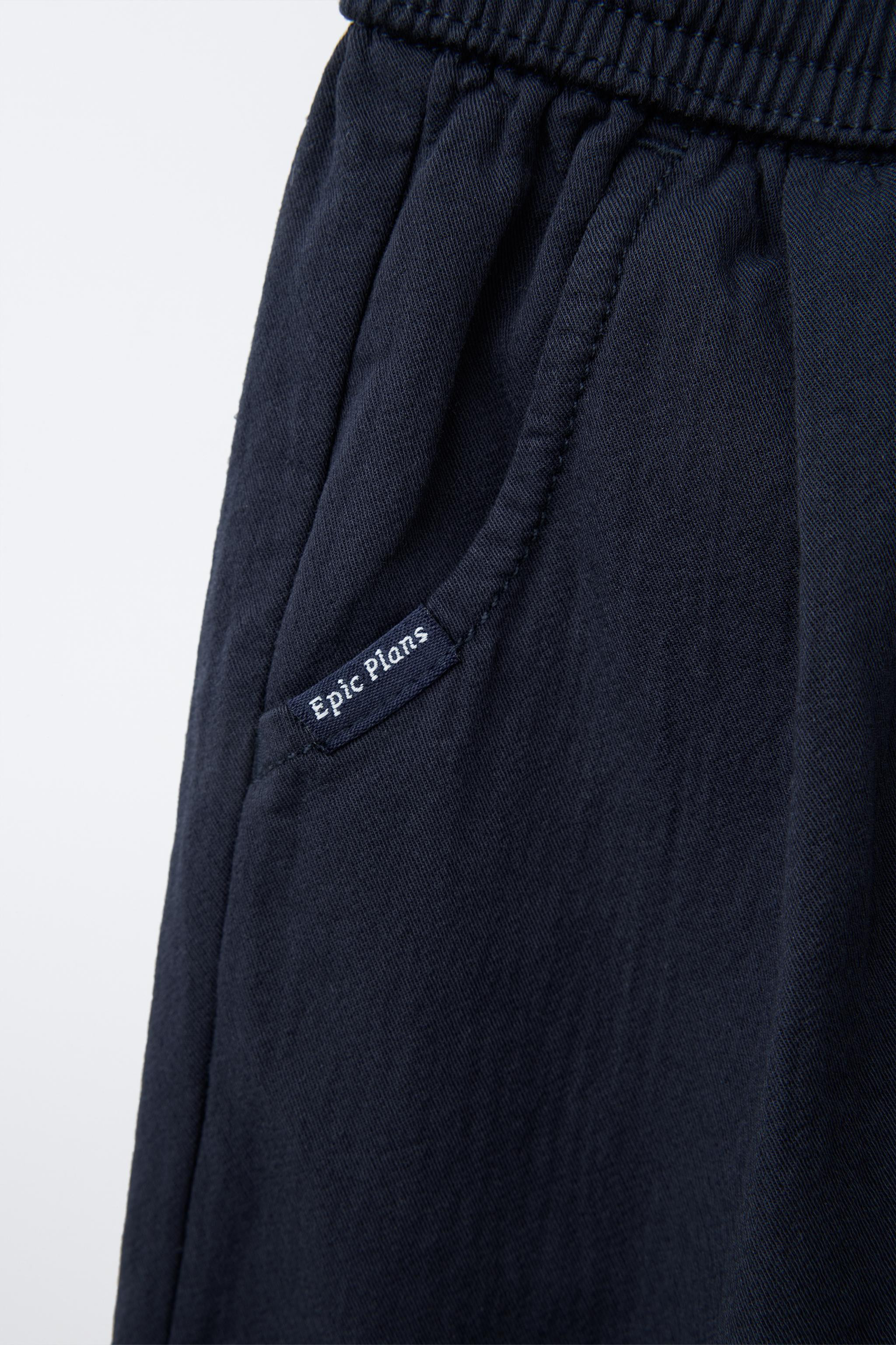 Pants with elastic waistband and adjustable front drawstring. Front pockets with label appliqué. | Zara US
