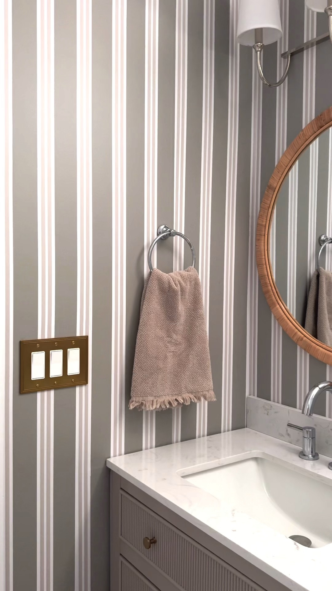 I gave our basement bathroom a little love with the help of Chasing Paper! I was immediately drawn to this wallpaper (I love a good stripe) in the “moss” colorway and love how it transformed our bathroom from a boring, sterile space into a room that feels warm and inviting. I layered in a few accessories, a cool mirror and sconce, and you’re going to want to check out this vanity. The room finally feels complete!

#LTKHome #LTKSeasonal #LTKdayinmylife