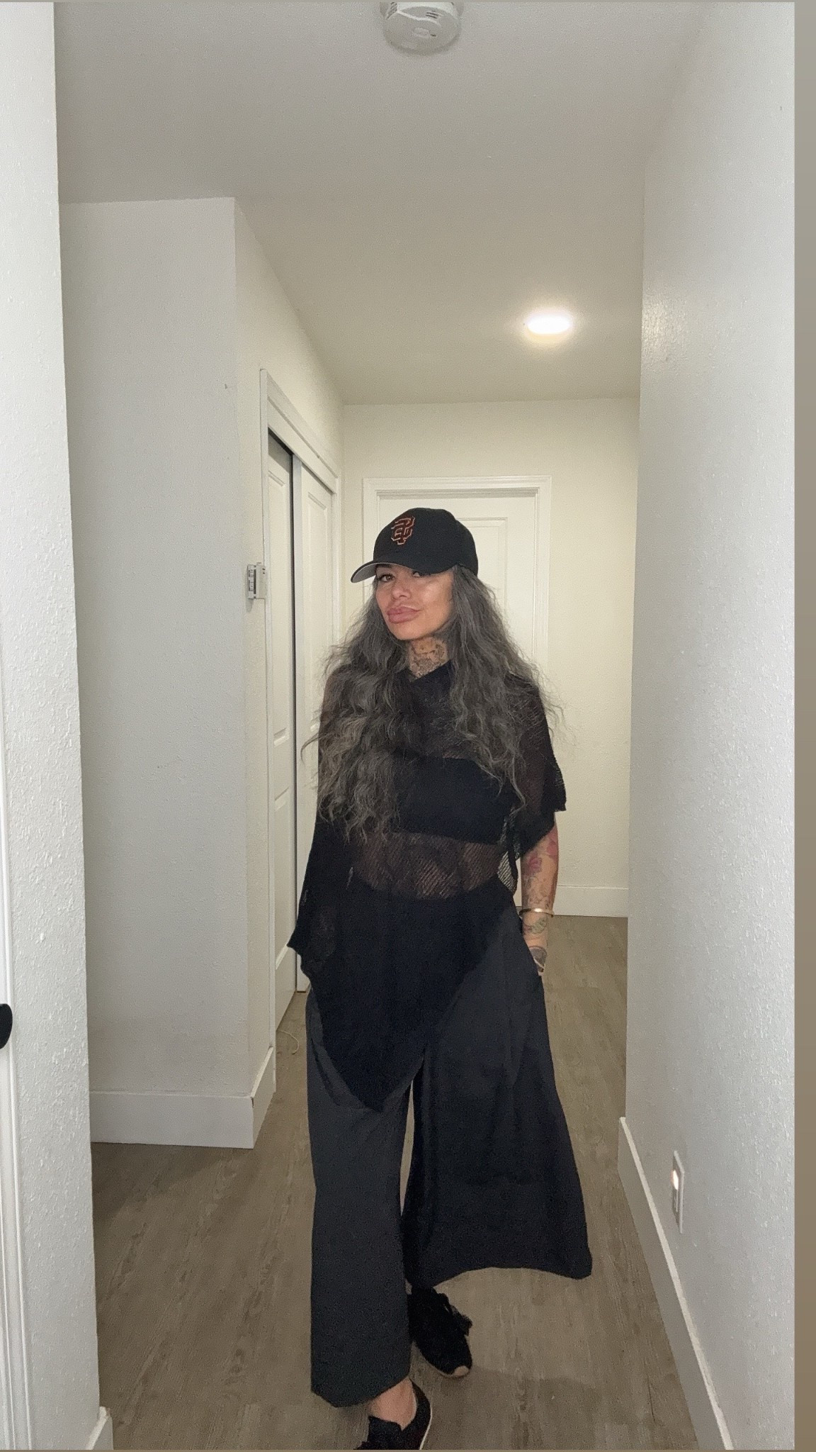 
Black is the mood today.
Uniqlo culottes giving that shorts-but-make-it-skirt vibe, little bandeau moment, cozy poncho from Amazon, and lace tennis shoes to keep it cute.

Topped it off with my SF Giants hat because a Chicana always keeps a little flavor in the fit.

Simple, comfy, y con estilo. 💅🏽

#OOTD #FridayFit #ChicanaStyle #SilverFox #GiantsStyle

#LTKdayinmylife #LTKOver40 #LTKPetite