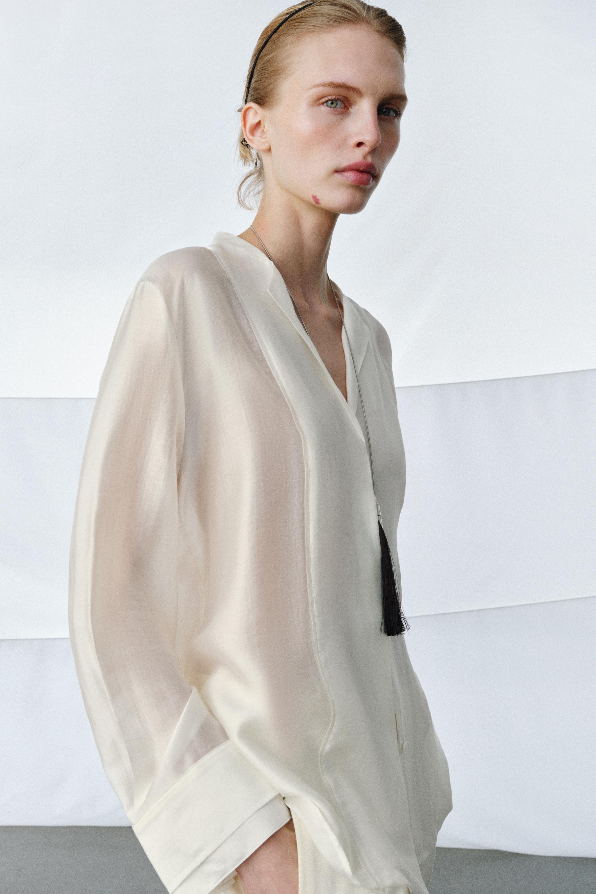 ZARA WOMAN COLLECTIONFlowy shirt made from a lyocell blend yarn. Lapel collar and V-neckline with... | Zara US