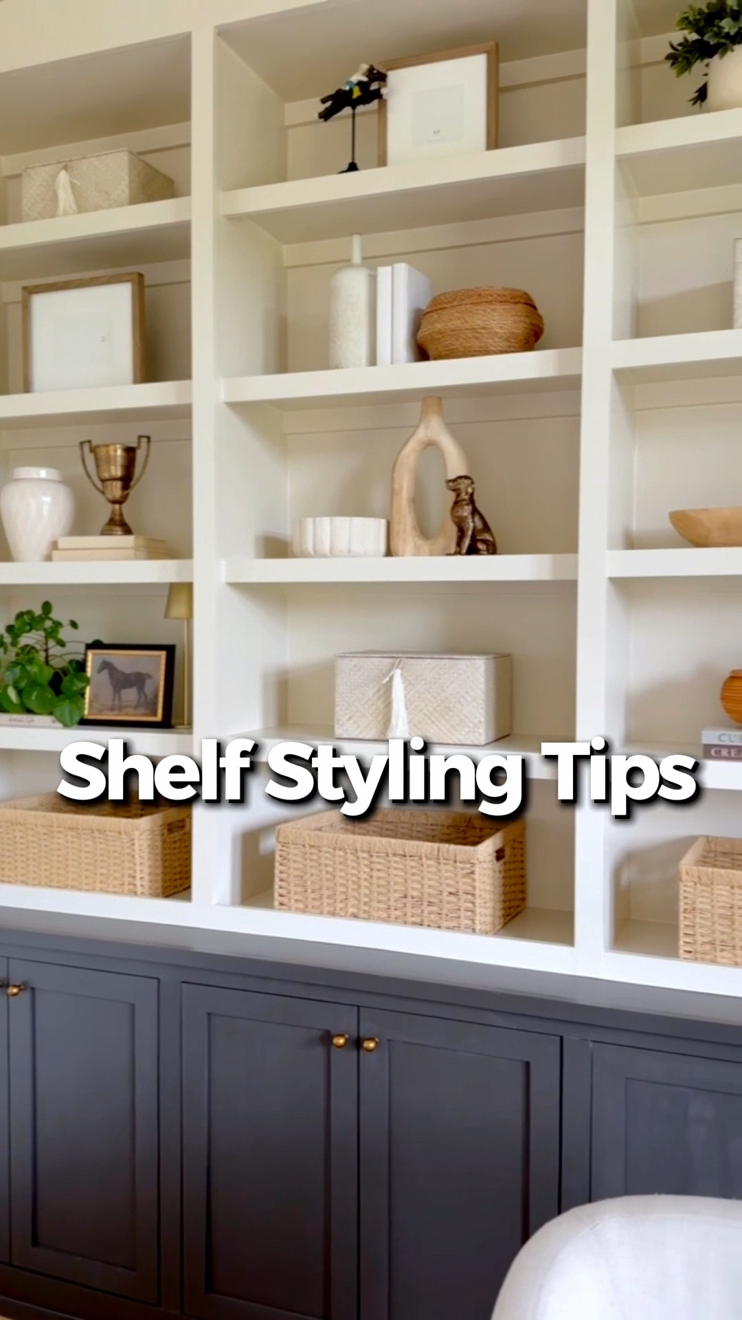 Shelf styling made easy! 

1. Use the rule of three. 
Group objects in sets of three with varying heights (for example: a small stack of books, a medium vase, and a taller sculptural piece). Odd-number groupings feel more natural and balanced.

2. Leave breathing room. 
The biggest mistake with shelves is overfilling them. Let some space stay empty so the pieces you do place feel intentional and curated.

3. Add one organic element like a small plant, olive branch or driftwood piece. It softens the neutrals and keeps the shelves from feeling too structured.

4. For neutral shelves, mix textures, not colors . 
When everything is neutral, texture becomes the interest. Layer items like woven baskets, ceramic vases, linen books, wood beads, and stone objects so the shelf feels rich without adding color.

#LTKOver40 #LTKHome