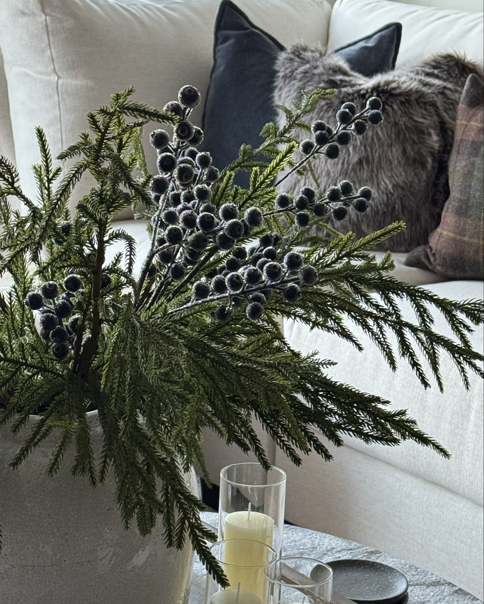 The vibe this year; rustic English Christmas cottage 🤎

The Norfolk pine stems can be found anywhere. I got these from Gatehouse a few years ago, a local home store. But you can find these stems anywhere as they’re sold in many places during the holiday season. I’ve linked an alternative below  

The frosted blueberry stems are from home goods. I tried to find them online but wasn’t able to. I’d recommend going to your local home goods to find them. They were available in both red and blue. I’ve linked some alternatives below. 

The Arhaus brown fur pillow cover is linked below. They no longer sell it in  brown but they have it in a few other colors.

#LTKHoliday #LTKdayinmylife #LTKSeasonal