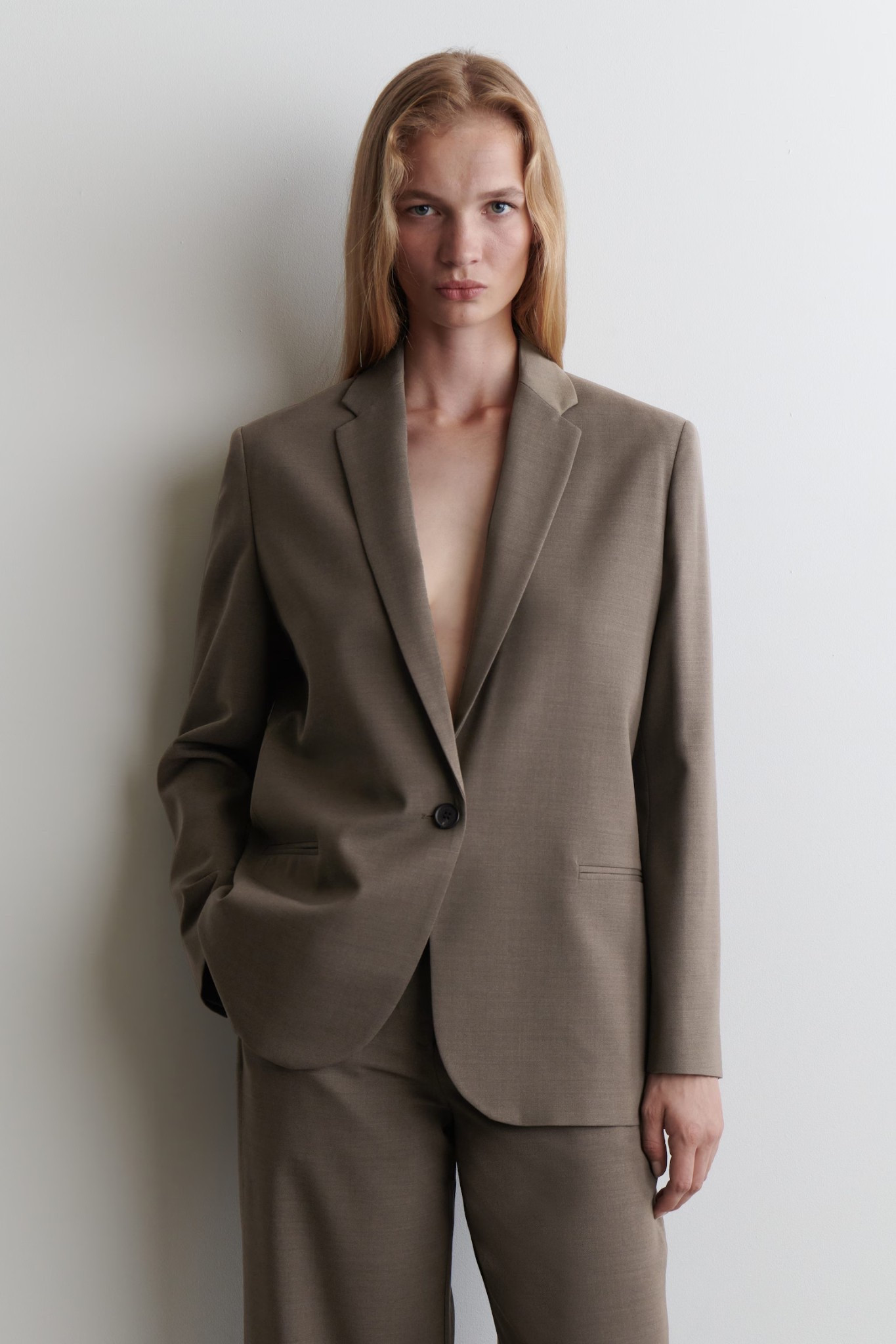 If you’re looking for a blazer this season in a wearable, beautiful hue—this might be your one. Wool, tailored, longline, single lapel, quiet luxury at its best.

True to size.

- Merino wool-blend fabric
- Notch lapel
- Long sleeves; buttoned cuffs
- Single-breasted design
- Twin pockets