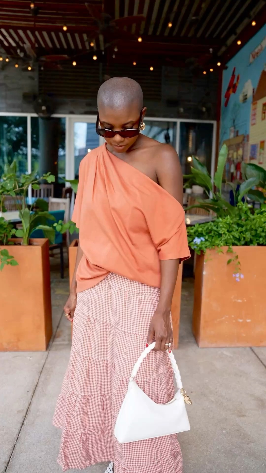 The softest summer vacation outfit! Off the shoulder tee (comes in more colors) I’m wearing a small. Orange plaid linen skirt, white woven ballet flats and zebra print purse.

#LTKOver40 #LTKootd #LTKTravel