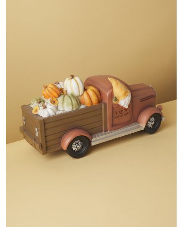 16in Ceramic Gnome In Truck Decor | HomeGoods