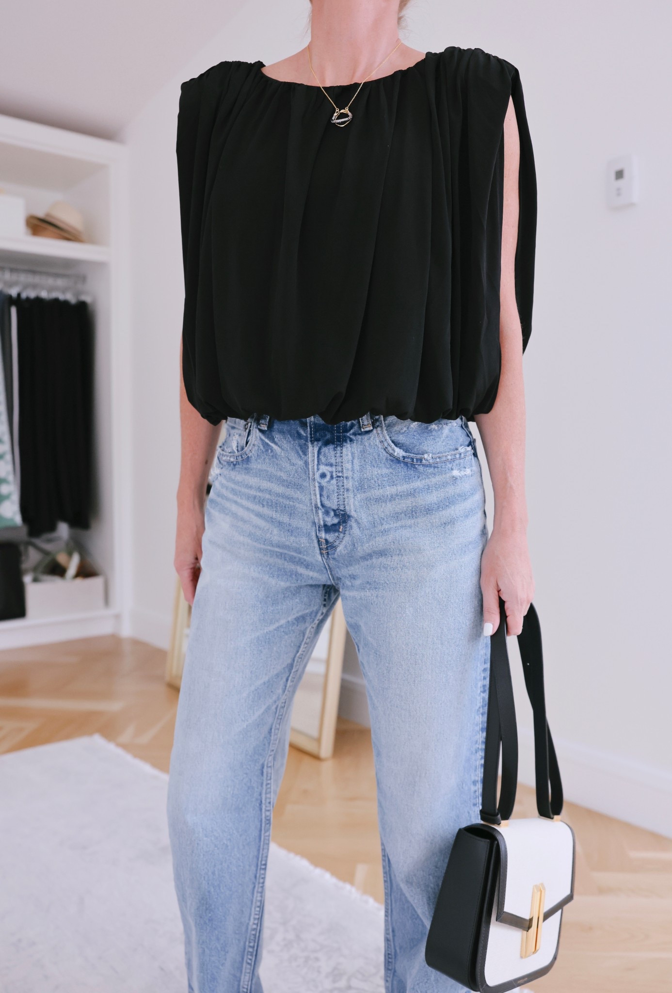 This beautiful black top is not only incredibly flattering and elegant, it’s also super affordable! Use my exclusive Anthropologie code ERINB20 for 20% off. ✨

~Erin xo 

#anthropologie 

#LTKSeasonal #LTKFindsUnder100 #LTKSaleAlert
