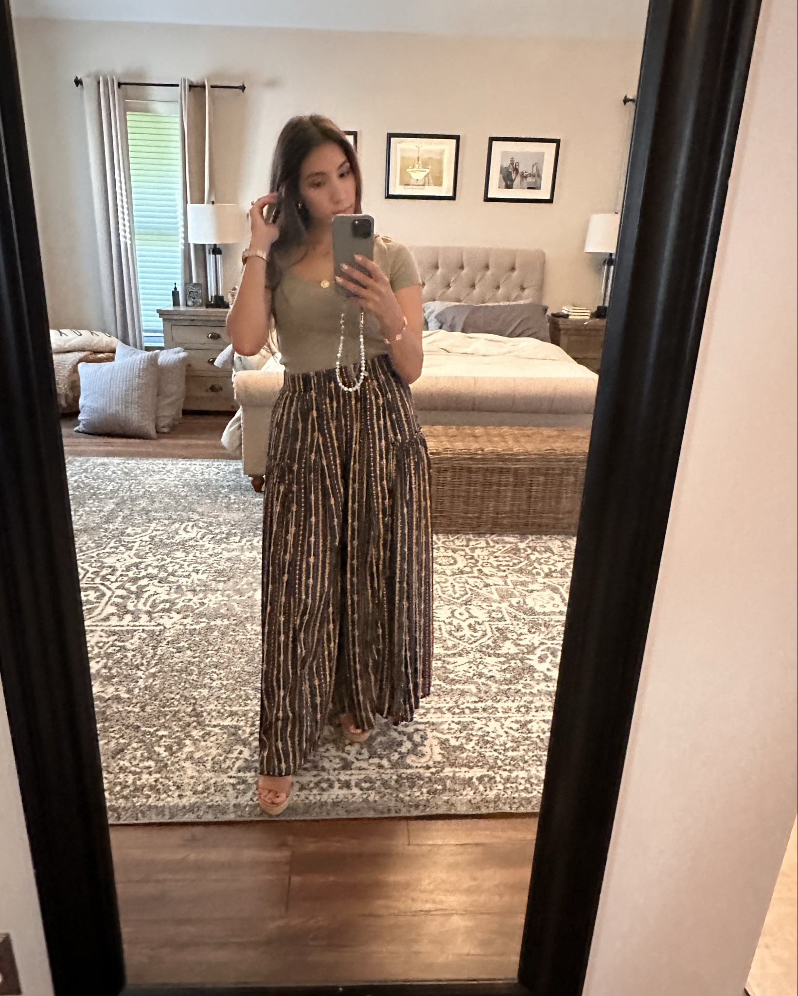 These Free People wide-leg So Charming pants really live up to their name ✨ The silky, smooth fabric drapes like a dress. 💃 The flowy shape is so flattering and feminine while still being comfy enough for all-day wear. The print is  so beautiful in person, with a rose detail  I paired mine with an old light olive ribbed top and wedges for an easy yet elevated look. Wearing the smaller size here—true to size, no need to size up. A definite work-to-weekend favorite! 🌿🌹

free people wide leg pants, free people so charming pants, free people trousers, free people silk pants, dan rose fabric pants, dan rose pattern pants, wide leg work pants, flowy dress pants, petite friendly wide leg pants, elevated workwear pants, feminine office outfit, boho chic pants, free people outfit ideas, fall workwear look, comfortable dress pants, stylish teacher outfit, wide leg pants outfit inspo, boho wide leg trousers, free people petite pants

#effortliss

#LTKWorkwear #LTKPetite #LTKStyleTip