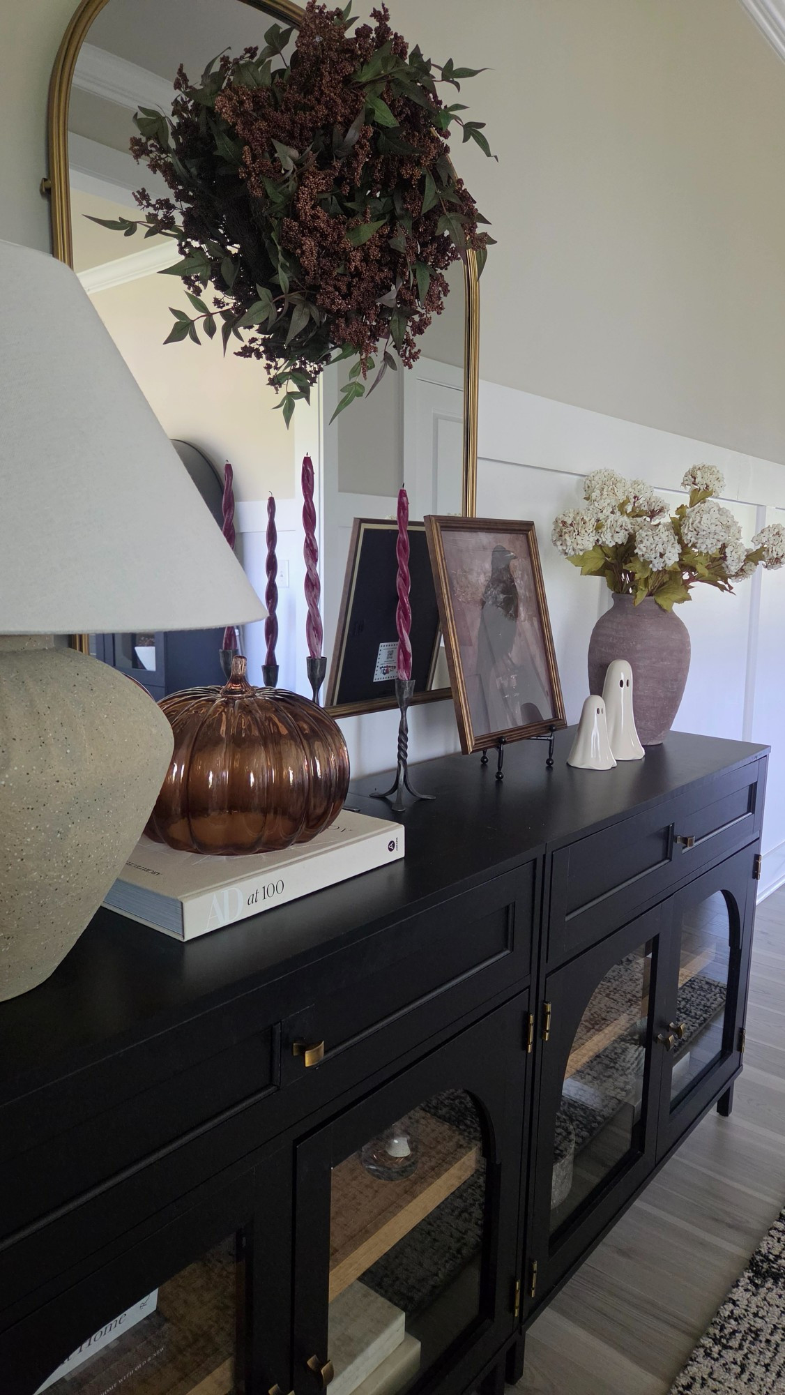Rich textures, glowing amber glass, and subtle spooky accents create a layered and moody entryway look. Deep berry tones and candlelight bring the perfect cozy autumn warmth.#FallDecor #HalloweenDecor #EntrywayDecor #MoodyHome

#LTKSeasonal #LTKHome