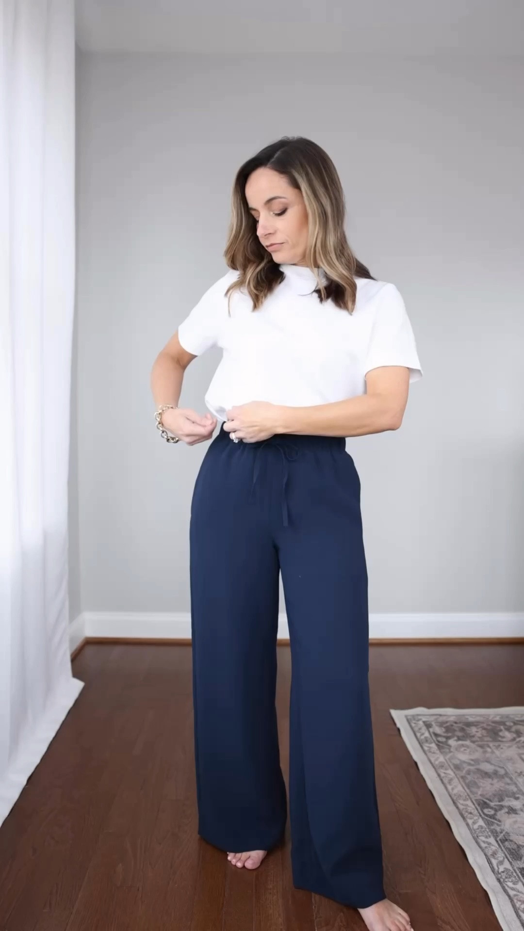 The Lodge pants are back in stock in short! 

In xxs the pants have a 28” inseam but as the sizes go up the inseam increase. XS has a 28.5” inseam so these may not be the most petite friendly for everyone. 

Pants (Aritzia): xxs short
Top (Old Navy): petite xs 
Jacket (Quince): xs
Bag (Quince) 
Shoes (Gola) 

My measurements for reference: I’m 4’10” and 105lbs. My bust, waist, and hip measurement is 32”, 24”, and 36”.