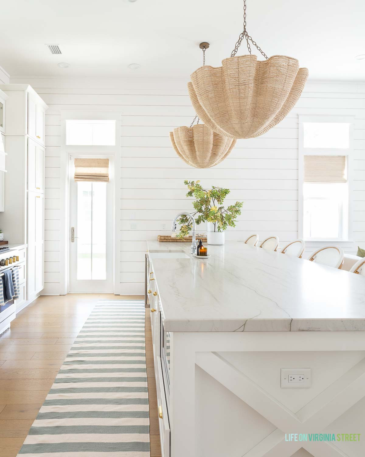 Coastal kitchen modern home // chandelier // stems // runner rugs  

 #LTKSeasonal #LTKHome