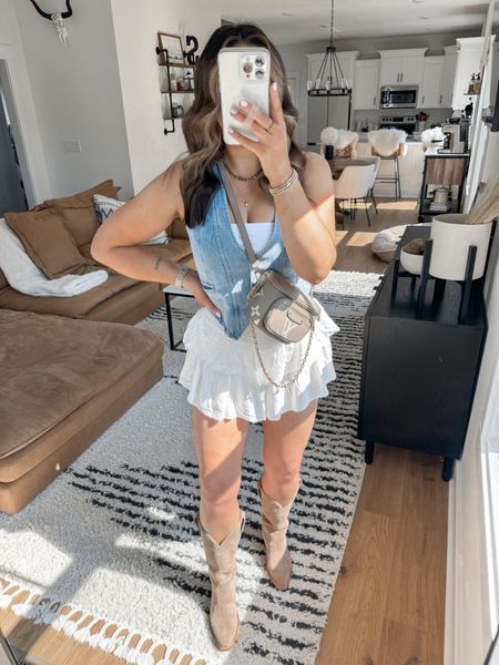 Country Concert Outfit Inspo 🎵🤍

I love this denim & white western look! I’ve been wearing this denim vest on repeat lately — so many ways to style it! Bonus points because this “skirt” is actually a SKORT 👏🏼 also wearing my favorite western boots! 

Tube Top — xs
Denim Vest — medium
Skort — small
*my bag is the grey color option! 

Also linked the shapewear thongs that I LOVE!! They’re the perfect smoothing underwear without feeling too tight or constricting! 

neutral outfit | Nashville outfit | Nashville style | western outfit | western fashion | cowgirl boots | winery outfit 



#LTKStyleTip #LTKItBag #LTKShoeCrush