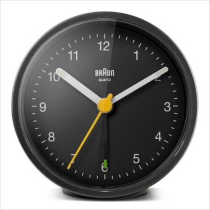 Braun classic black analog alarm clock with luminous hands and snooze button