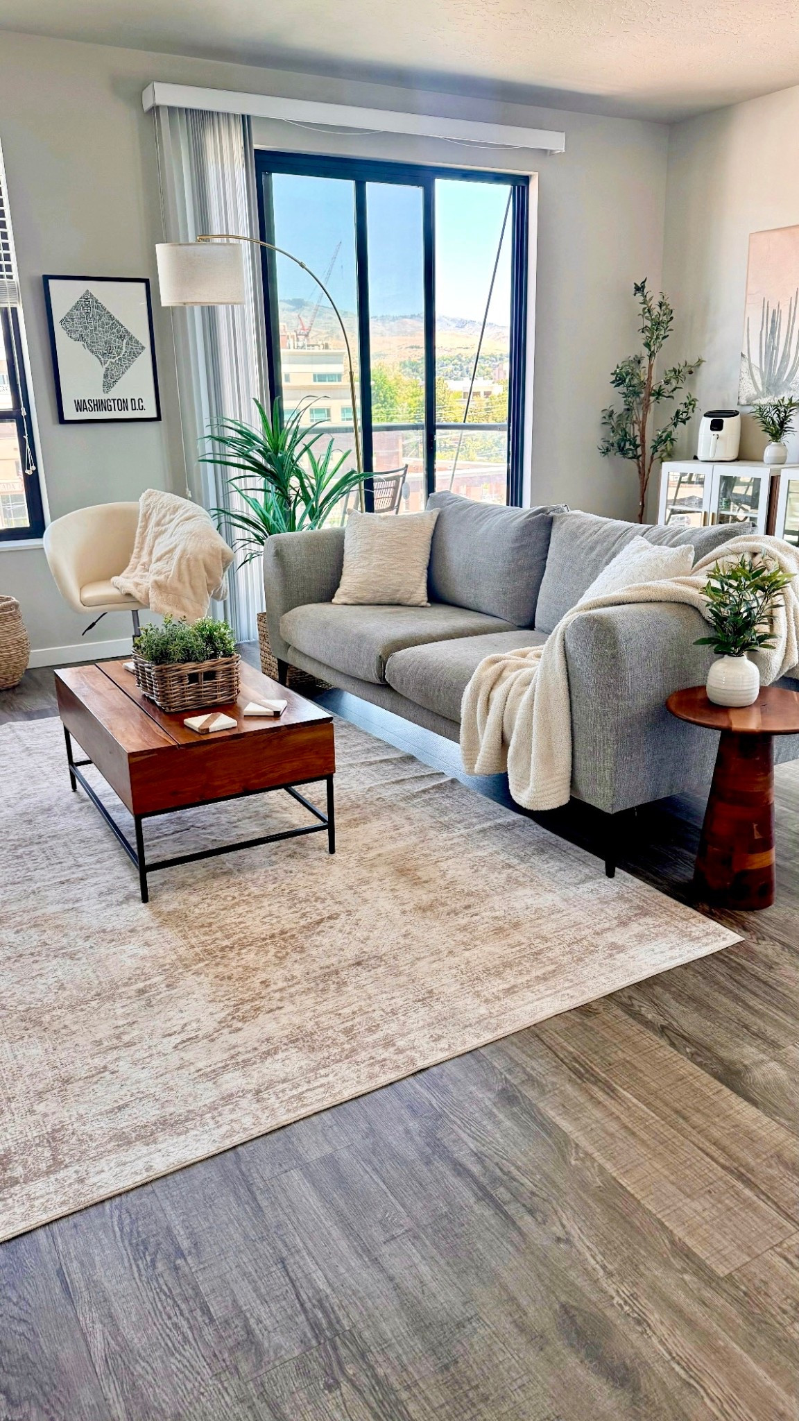 Living room ✨🛋️

• Rug is 6 x 9 and soo soft. 
• Coffee table top lifts up to create a mini table! 
• Lamp is only $90 but looks so much more expensive 
• Sofa is West Elm and worth the investment 