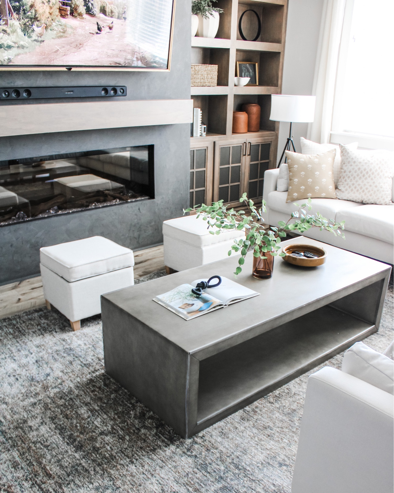 Fireplace with Black Coffee Table Books and Driftwood - Transitional -  Living Room