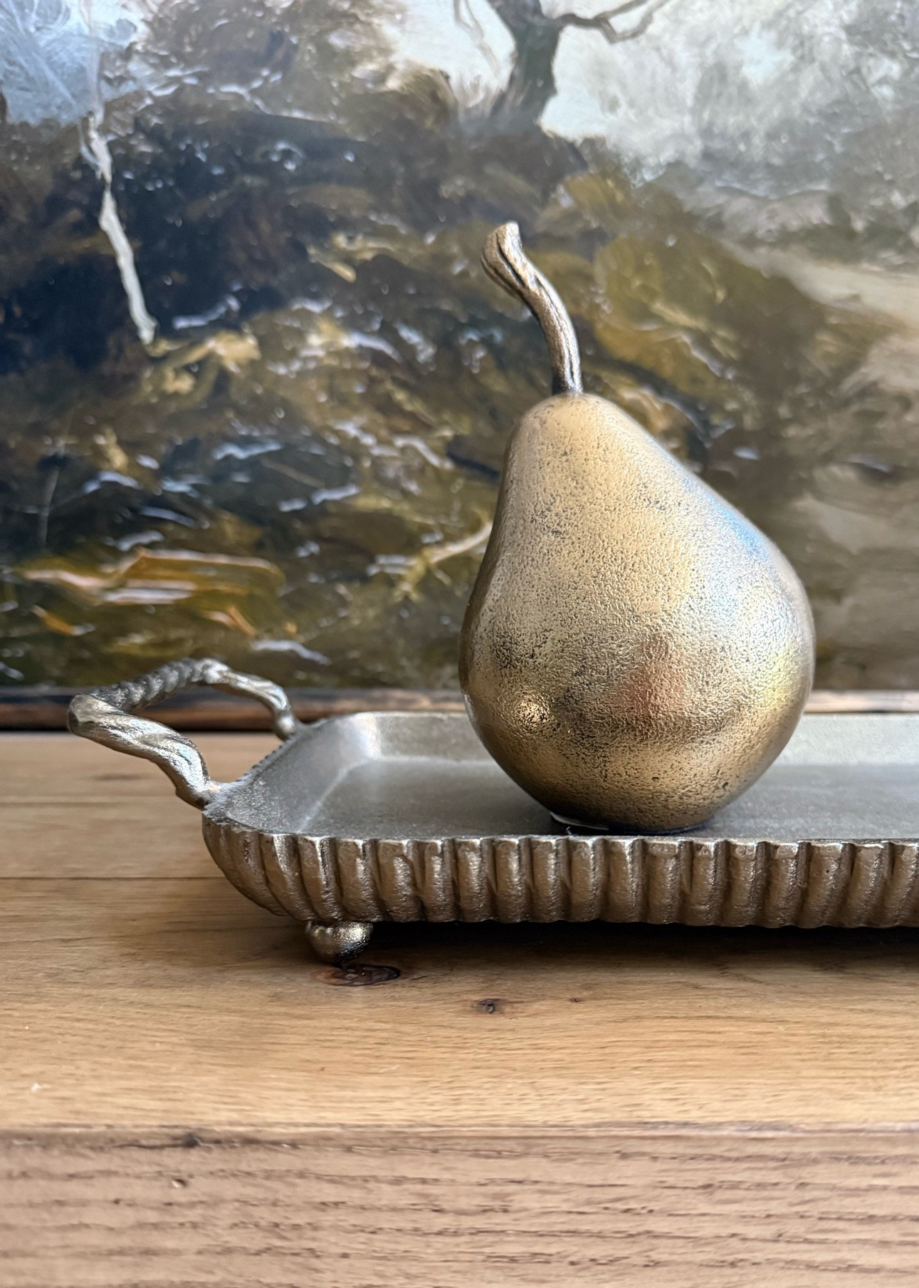 Add a touch of elegance with this bronze pear.