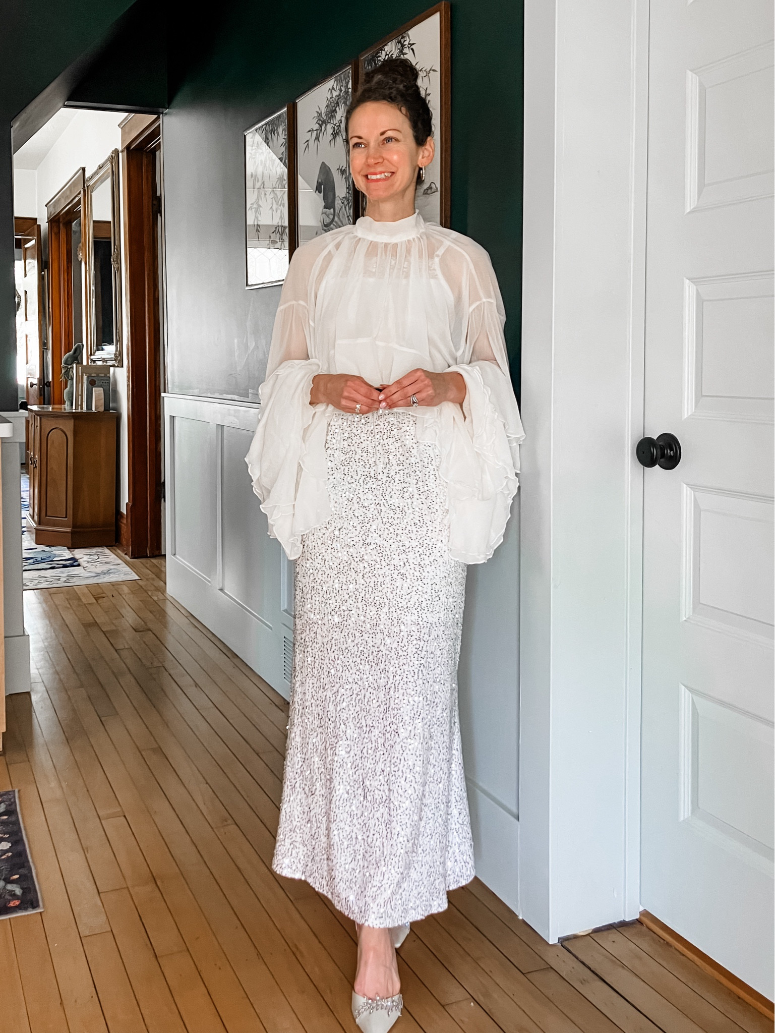 A statement top for summer!
White chiffon statement top from Chicwish. 
Sequin skirt from Chicwish. 
Crystal hoop earrings from a local boutique, linking similar. 
White heels from Bella Belle Shoes. 
Cropped lace top from Amazon. 
Petite outfit. Neutral outfit. Summer outfit. Party outfit. Modest outfit. 

#LTKOver40 #LTKgrwm #LTKootd