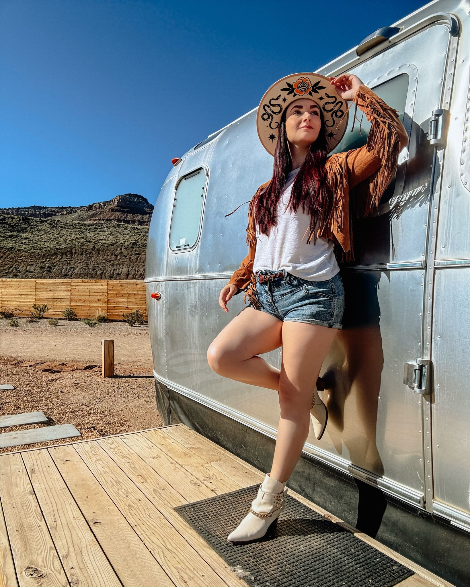 Desert dweller outfit. 🌵 Loved glamping neat Zion National park, Utah in this cute faux fringe jacket and jean shorts. I paired them with my cream colored floral rancher hat and white faux leather booties. 

#LTKParties #LTKFestival #LTKTravel