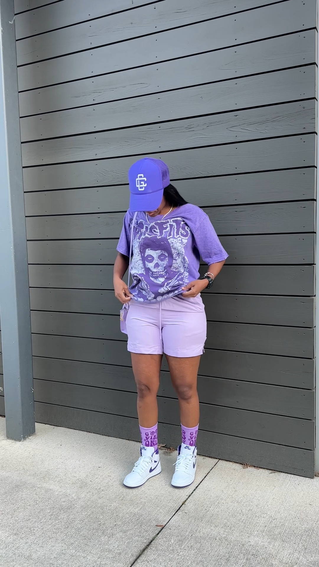 Street style summer outfit idea! I’m wearing a purple misfits graphic tee in a size xs, purple swimming trunks as shorts in a size small. I styled this outfit with a trucker hat, a purple mini crossbody bag, and Jordan 1 court purple sneakers

#LTKstyletip #LTKSeasonal #LTKFestival