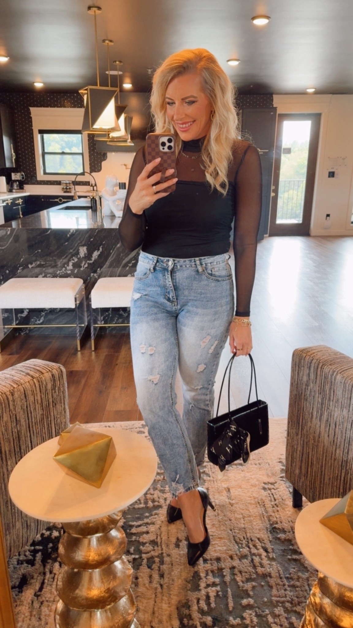 Workwear to date night - denim and classic black heels never go out of style. This sheer black top is lined and feels so good. Wearing a medium. 

Fall denim / purse / shoes 

#LTKStyleTip #LTKFindsUnder100 #LTKWorkwear