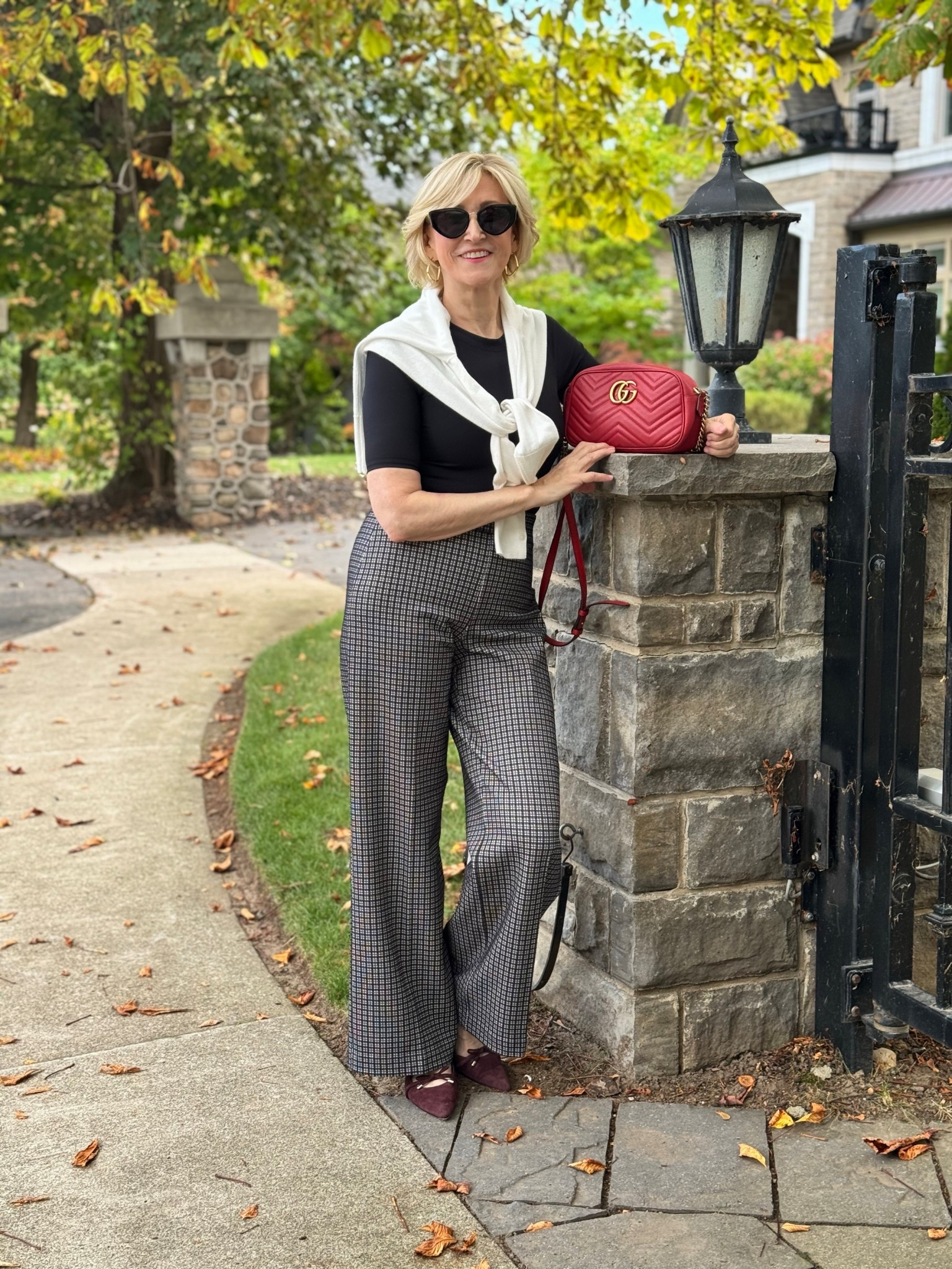 Classic with a twist, and effortlessly pulled together 🤍🖤
These Spanx houndstooth pants do all the heavy lifting, paired with a black short-sleeve knitted sweater for a clean, timeless base. I added a white long-sleeve sweater tied around the shoulders for that chic, layered moment and finished it off with ballet flats for easy elegance.

Comfortable, polished and perfect for days when you want style without the fuss.

#LTKootd #LTKOver40 #LTKSeasonal